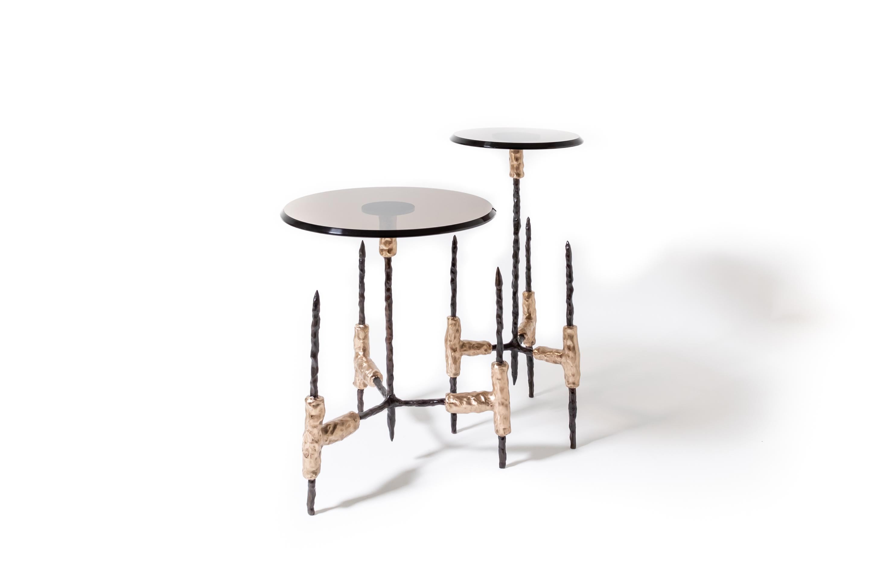 Our Garde Side Tables blends sculptural design with luxurious materials, making it a standout accent piece for sophisticated interiors. Featuring a refined bronze glass top and a richly detailed ebonized bronze frame with natural bronze accents,