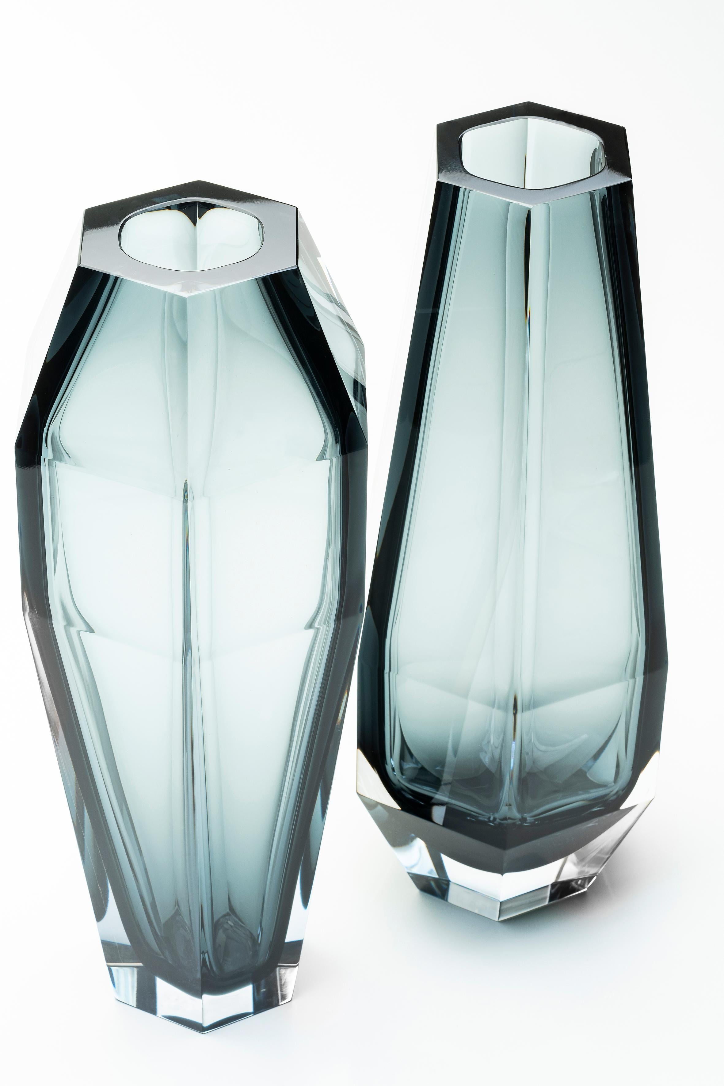 Set of 2 Gemello and Gemella vases by Purho
Dimensions: D15x H40 cm each
Materials: Glass
Other colours,finishes and dimensions are available.

Purho is a new protagonist of made in Italy design , a work of synthesis, a research that has lasted