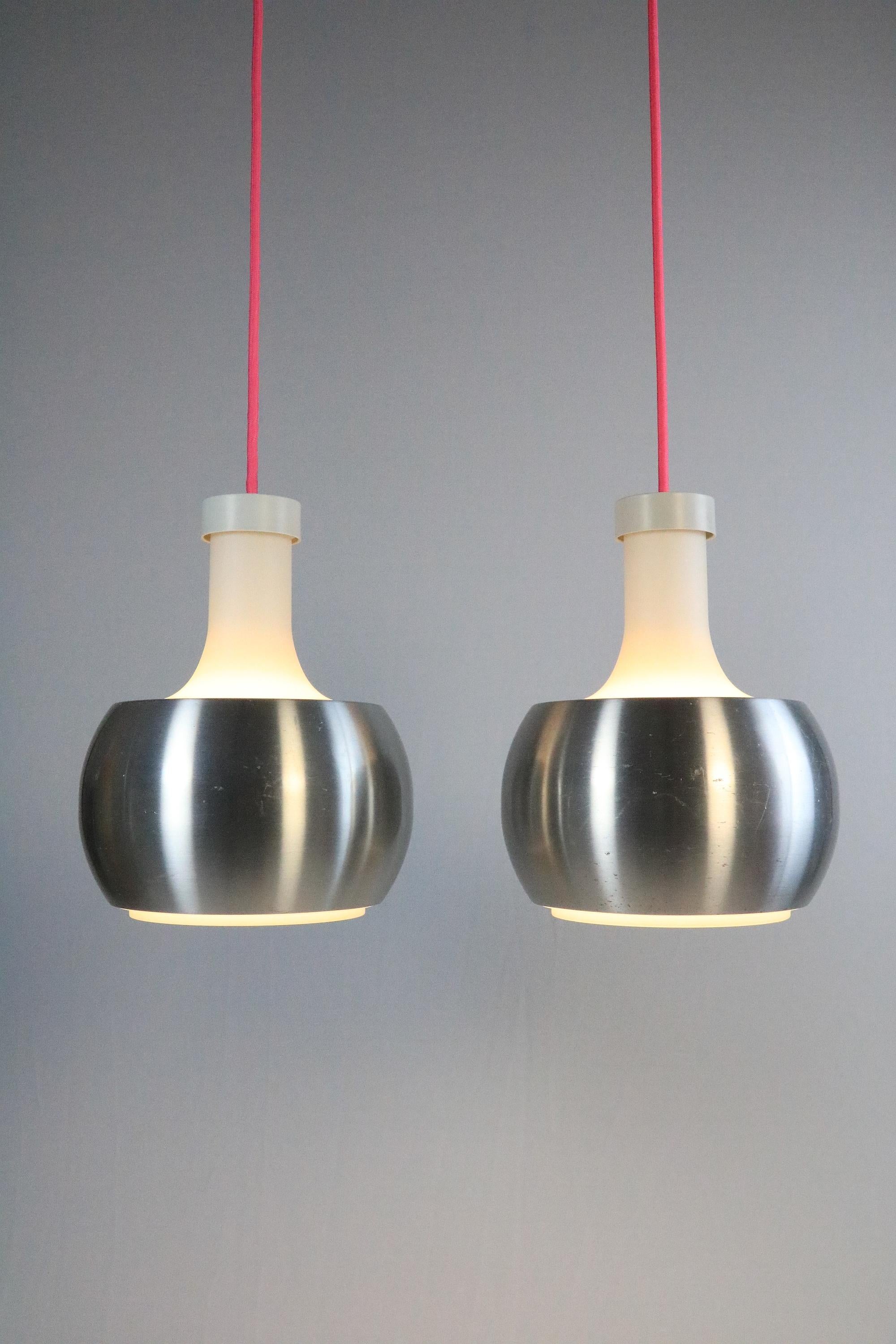 Great classics from STAFF.
Design: Rolf Krüger
 
Glass body and replaceable metal cylinder, which is simply placed over the glass.
There is also a single one in copper.
 
With an aluminum covers. These have scratches and one has a mini dent (see
