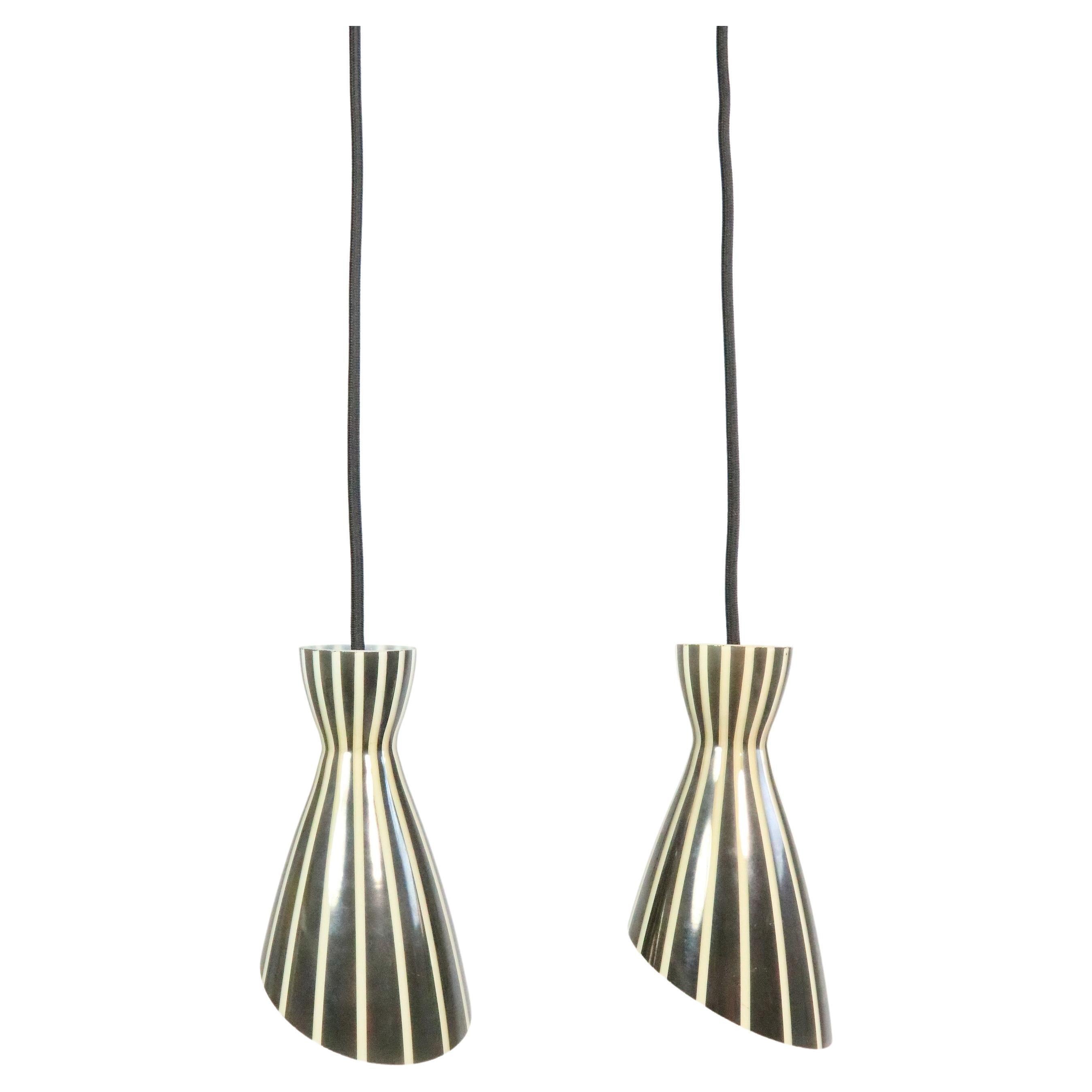 Delightful glass lamps with beautiful black and white striped design. 
Diabolo shape.
 
Originally part of a chandelier, they have been converted into hanging lamps with an E14 brass socket and black textile cable.
 
Looks wonderfully with a dining