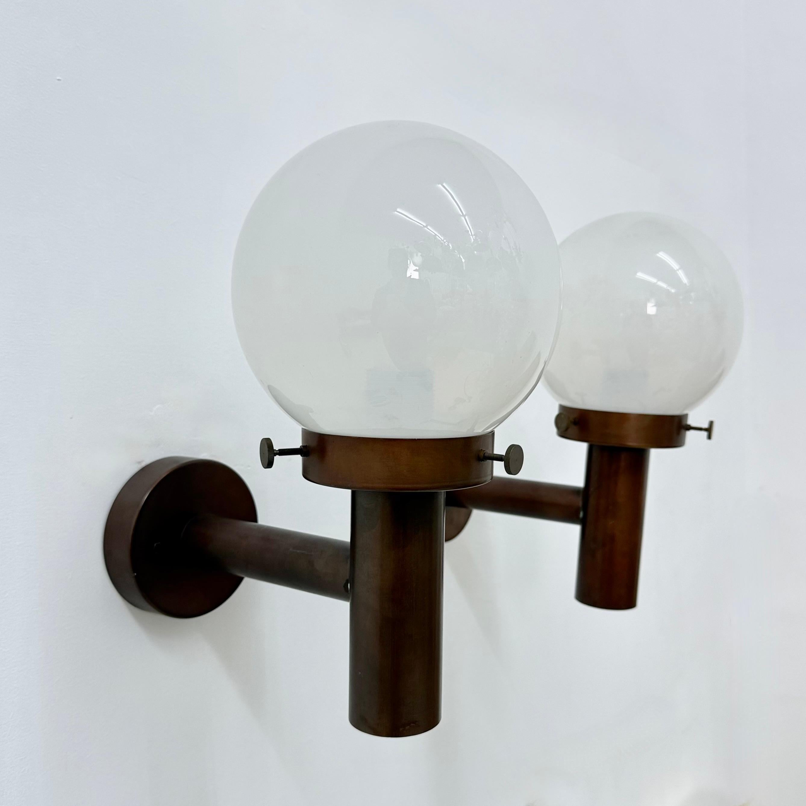 Set of 2 globe glass wall lamps sconces by Lisa Pape Sweden , 1970s

For outdoor use as well
Dimensions: 30cm Depth, 18cm Width, 33cm Heigtht
Condition: Good
Period: 1970s
Color: Red copper , glass