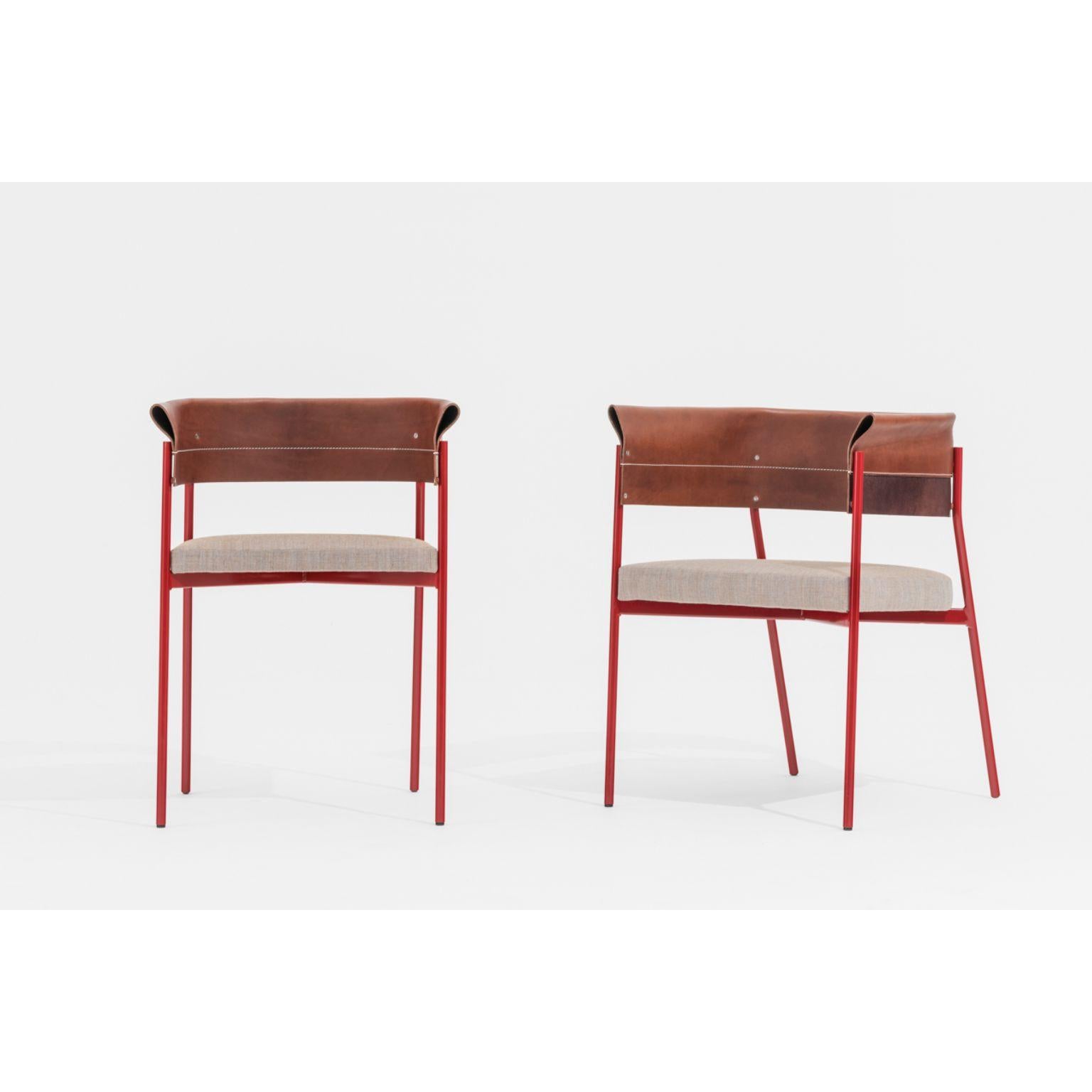 Set of Gomito chairs by SEM
Dimensions: W 54 x D 45 x H 75 cm
Material: lacquered hand-welved steel frame in colours, backrest in precious folded and sewn leather,Upholstered seat in fabric Canvas 2 by Kvadrat.
Also available in different colors.