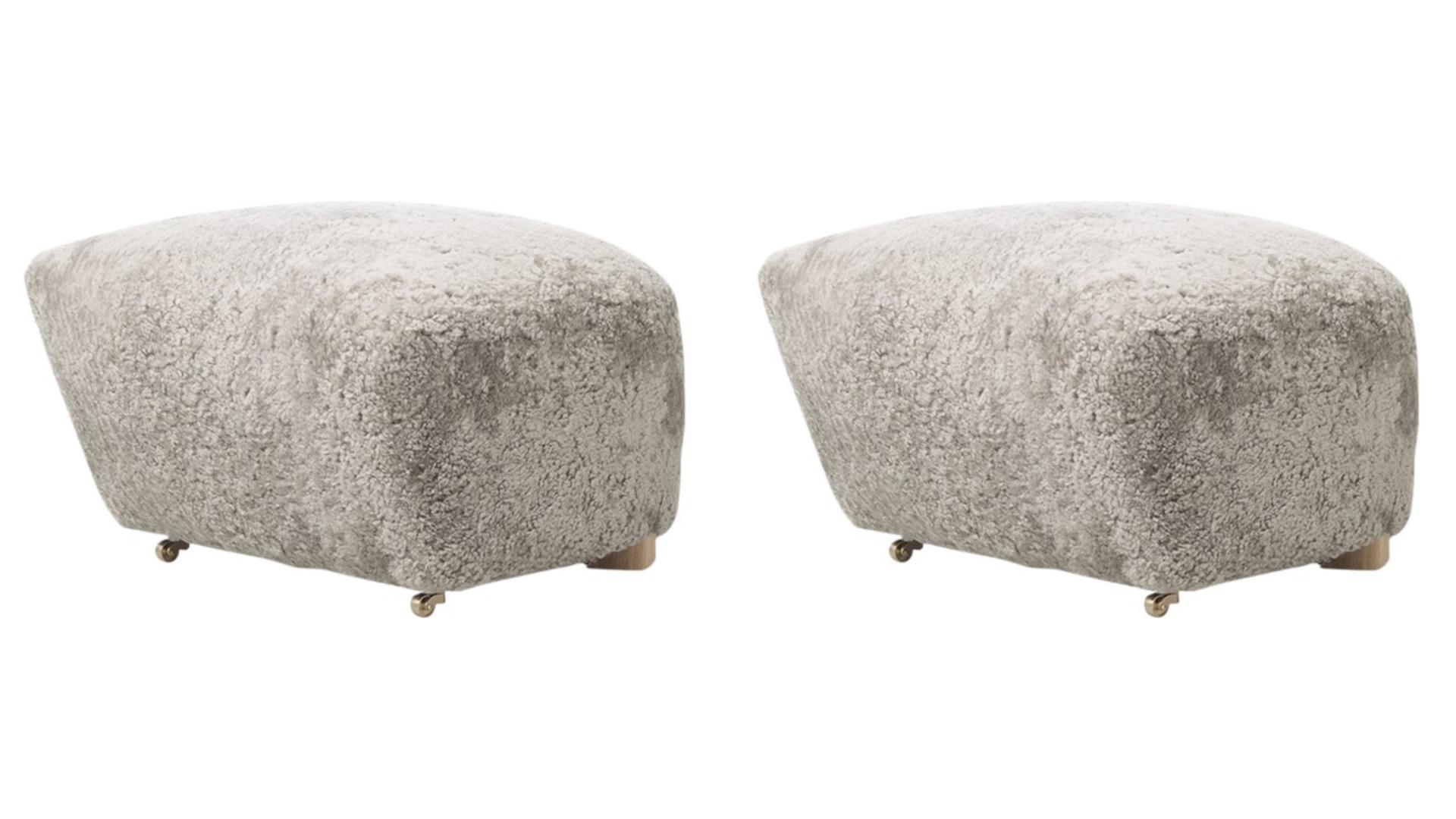 Set of 2 green tea natural oak sheepskin the tired man footstools by Lassen
Dimensions: W 55 x D 53 x H 36 cm 
Materials: Sheepskin

Flemming Lassen designed the overstuffed easy chair, The Tired Man, for The Copenhagen Cabinetmakers’ Guild