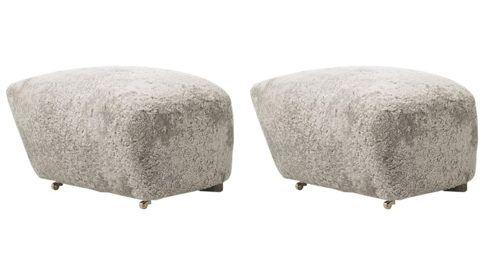 Set of 2 green tea smoked oak sheepskin the tired man footstools by Lassen
Dimensions: W 55 x D 53 x H 36 cm. 
Materials: Sheepskin.

Flemming Lassen designed the overstuffed easy chair, The Tired Man, for The Copenhagen Cabinetmakers’ Guild