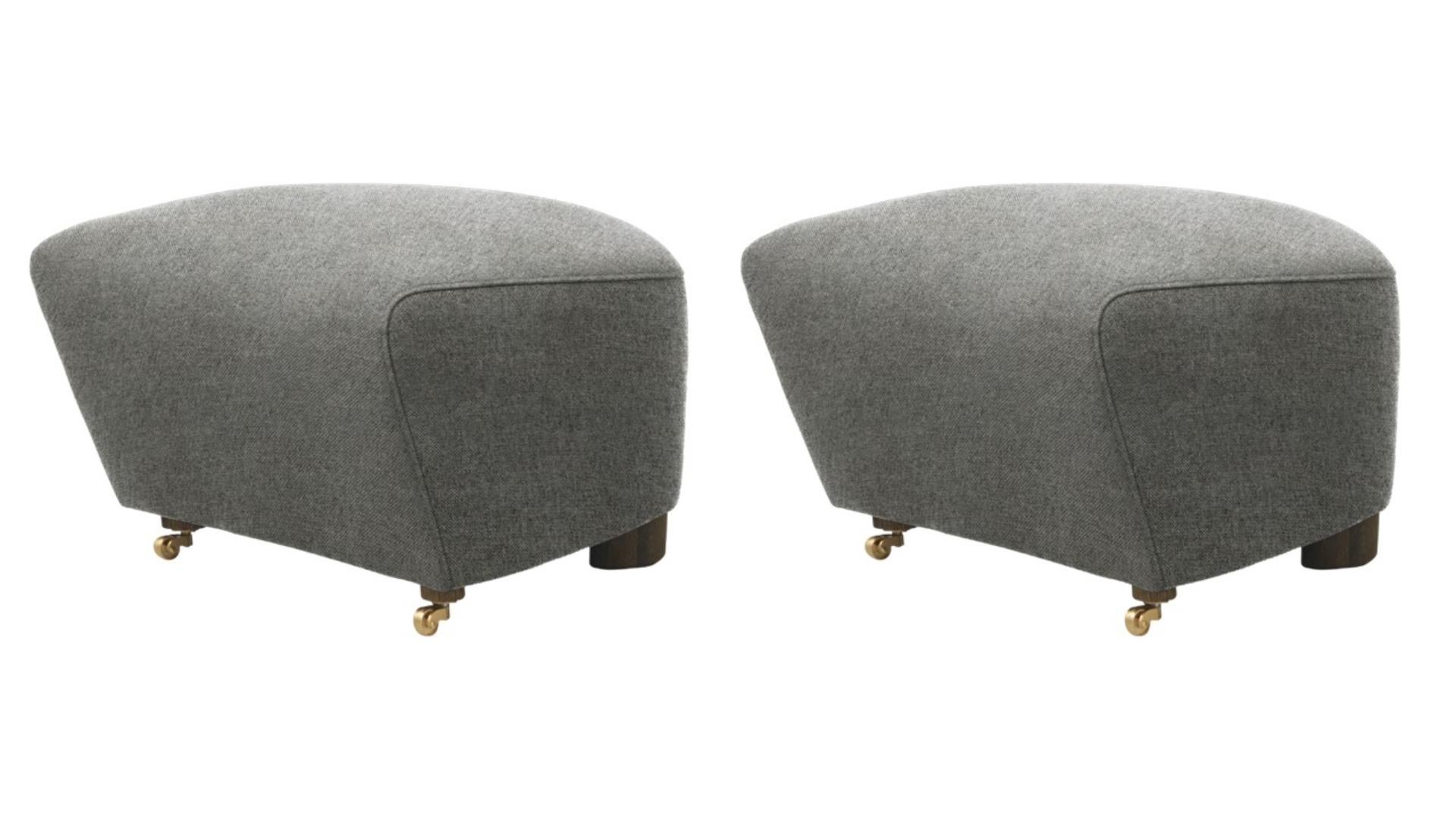 Set of 2 grey smoked oak hallingdal the tired man footstools by Lassen.
Dimensions: W 55 x D 53 x H 36 cm. 
Materials: Textile.

Flemming Lassen designed the overstuffed easy chair, The Tired Man, for The Copenhagen Cabinetmakers’ Guild