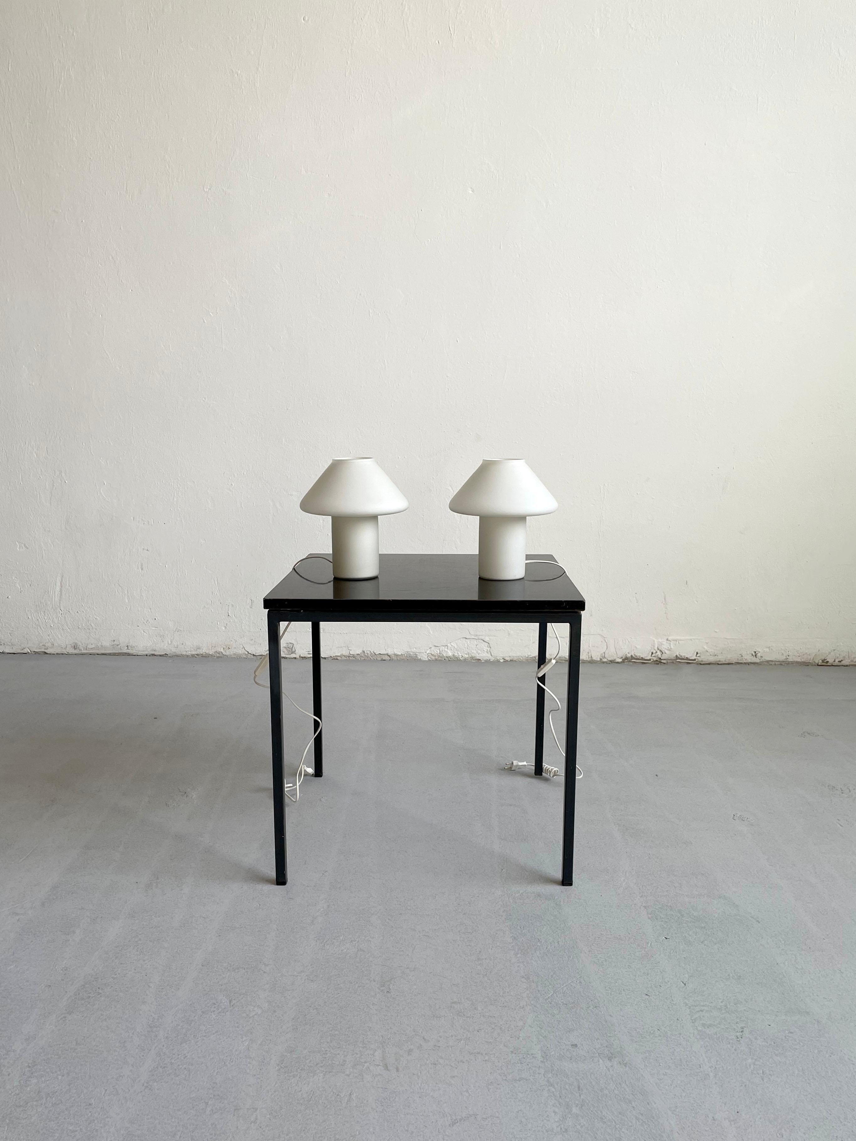 Set of 2 1970s white satin glass mushroom table lamps designed by the Dutch lighting manufacturer Hala Zeist. 
The lamps have a mushroom-shape top design with a cylindrical base. 

The lamps are unmarked.

Each lamp has one E14 lamp socket and an