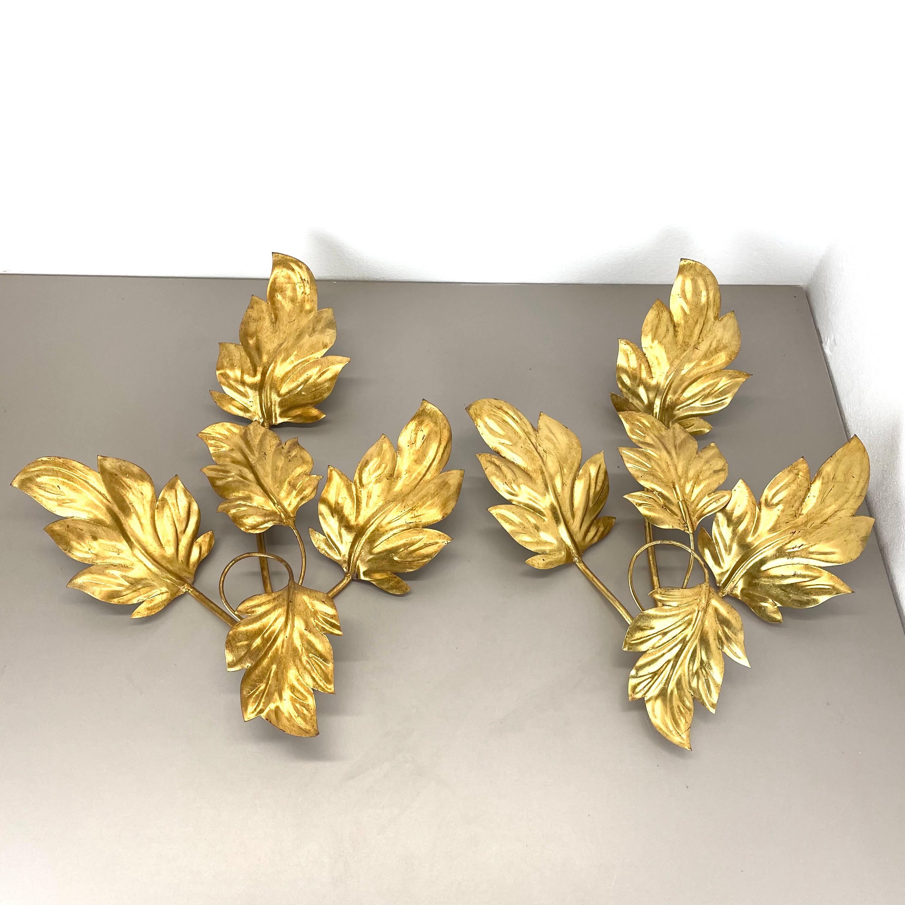 Article:

Wall light with LEAVES, set of 2


Origin:

Italy



Age:

1980.



This modernist light set was produced in Italy in the 1980s . It is made from solid metal in form of several huge LEAFES on the front covering the socket elements. The