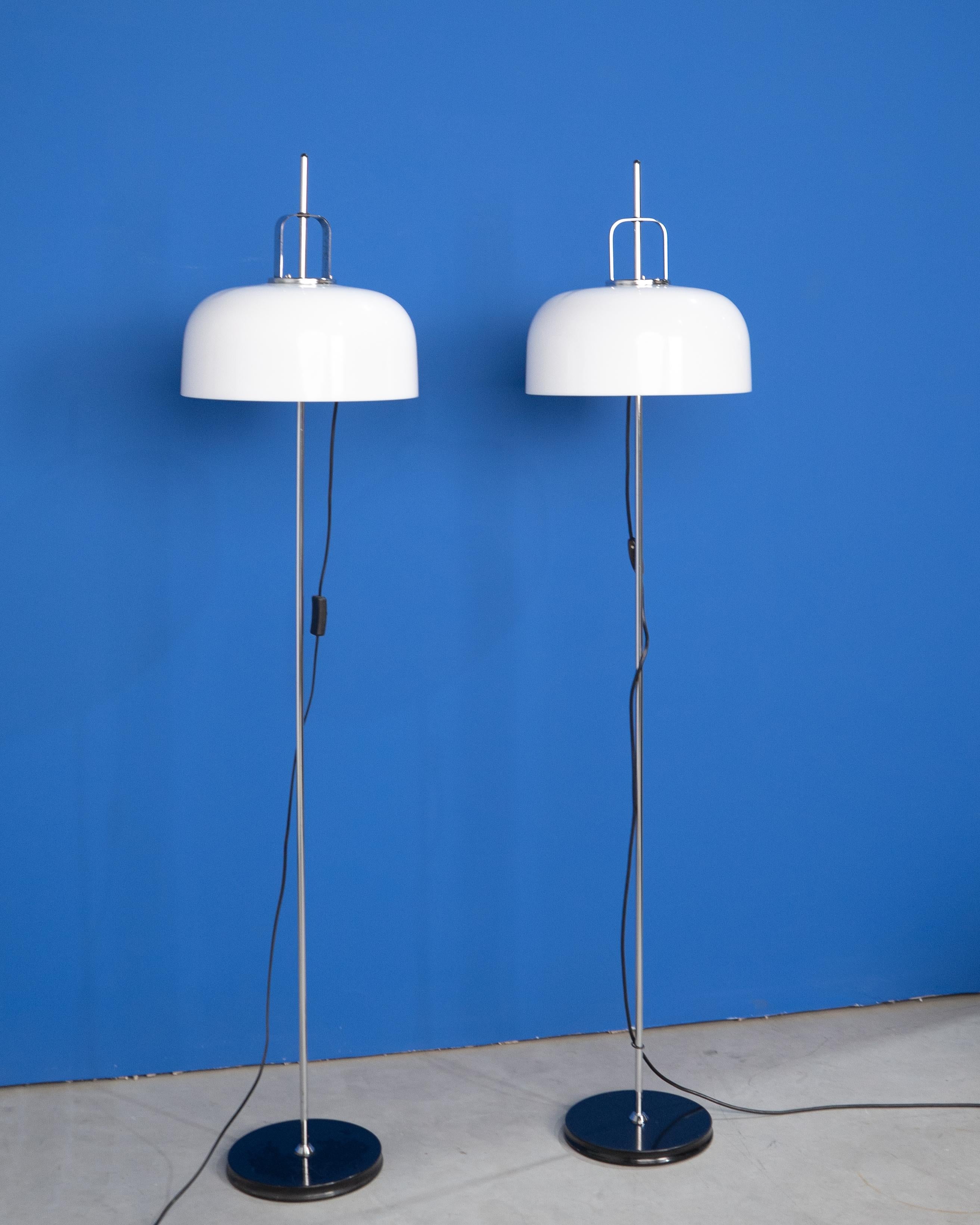 Elevate your interior with this stunning pair of vintage Meblo Guzzini floor lamps, a perfect representation of iconic Italian mid-century modern design. Crafted in the 1970s, these lamps feature elegant chrome stems and distinctive white acrylic
