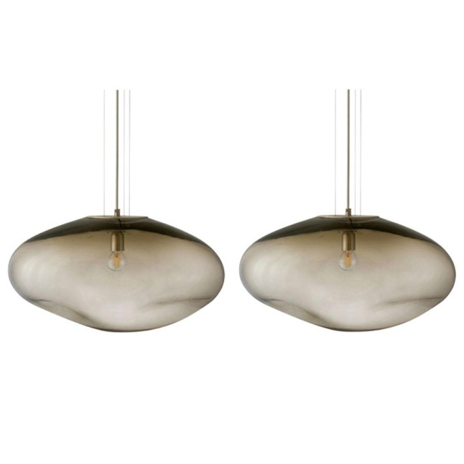 Set of 2 haumea amorph silver smoke xl pendants by Eloa.
No UL listed 
Material: glass,steel,silver, LED bulb.
Dimensions: D 35 x W 47 x H 32 cm.
Also available in different colours and dimensions.

All our lamps can be wired according to each