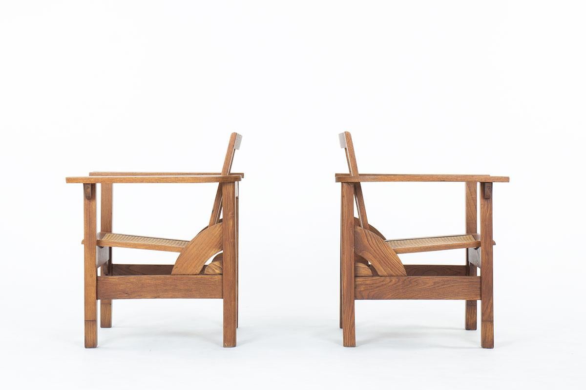 French Set of 2 Hendaye armchairs by Pierre Dariel in oak and caned, 1930