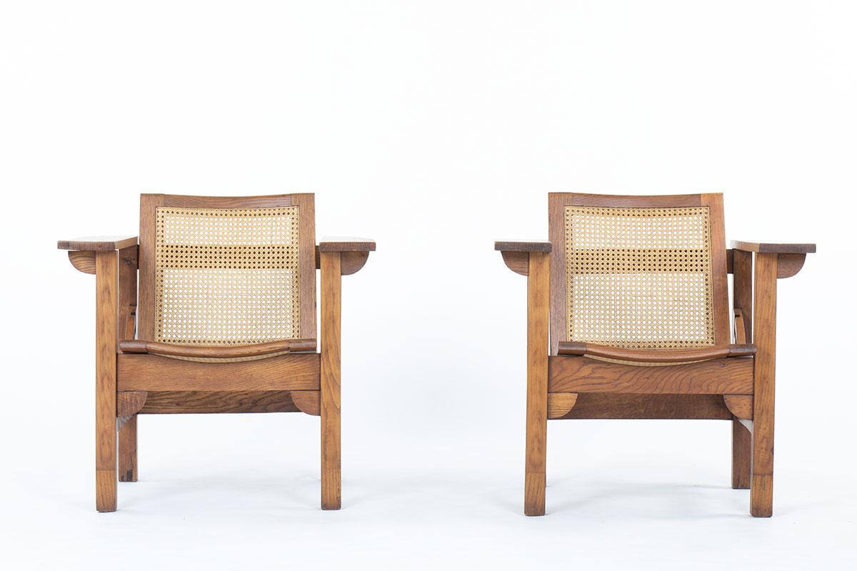 Cane Set of 2 Hendaye armchairs by Pierre Dariel in oak and caned, 1930
