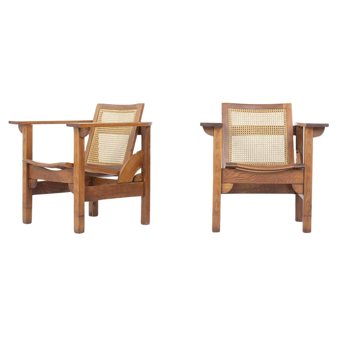 Set of 2 Hendaye armchairs by Pierre Dariel in oak and caned, 1930