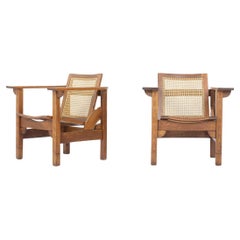 Antique Set of 2 Hendaye armchairs by Pierre Dariel in oak and caned, 1930