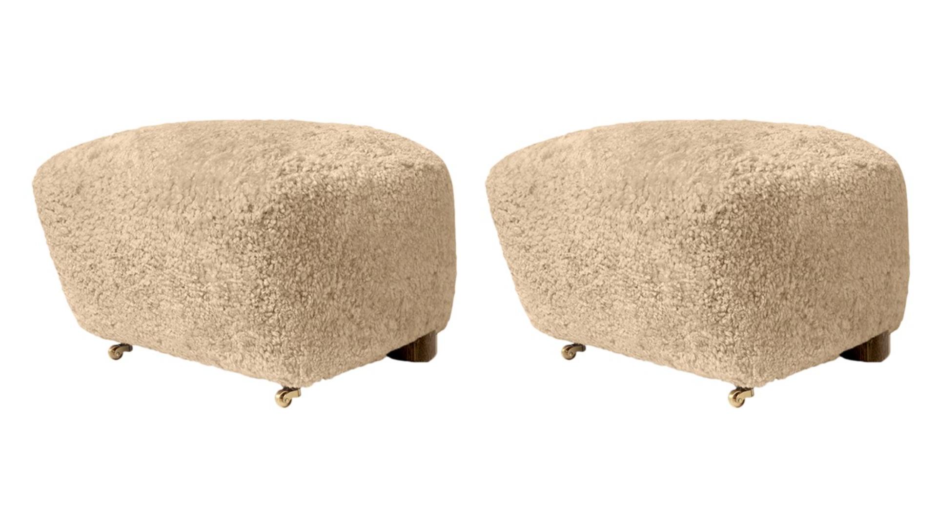 Set of 2 honey smoked Oak Sheepskin the Tired Man footstools by Lassen
Dimensions: W 55 x D 53 x H 36 cm 
Materials: Sheepskin

Flemming Lassen designed the overstuffed easy chair, The Tired Man, for The Copenhagen Cabinetmakers’ Guild