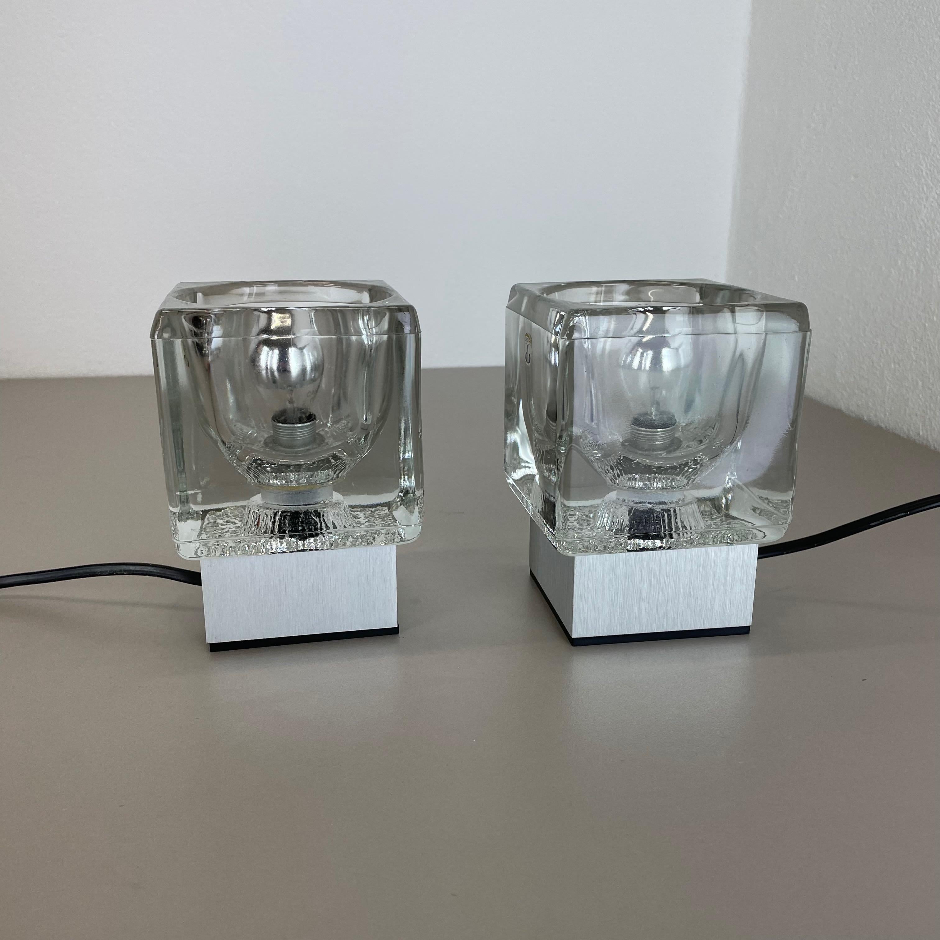 Article:

Glass table lamp set of 2


Producer:

Peill & Putzler, Germany



Age:

1970s



 

Original table lights designed and made in the 1970s by Peil & Putzler in Germany. The light shade element is made of one piece of