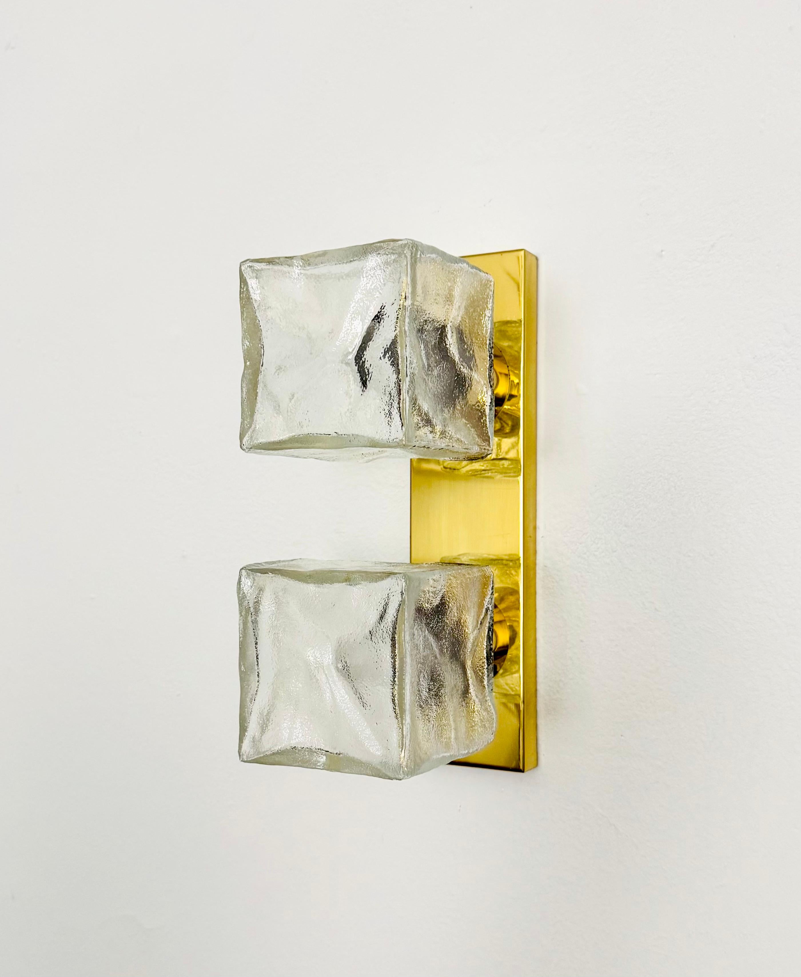 Wonderful ice glass wall lamps or ceiling lamps from the 1960s.
The beautifully shaped Murano glass elements create an impressive sparkling play of light.
Very high-quality workmanship and a real eye-catcher for any home.

Design: J.T.