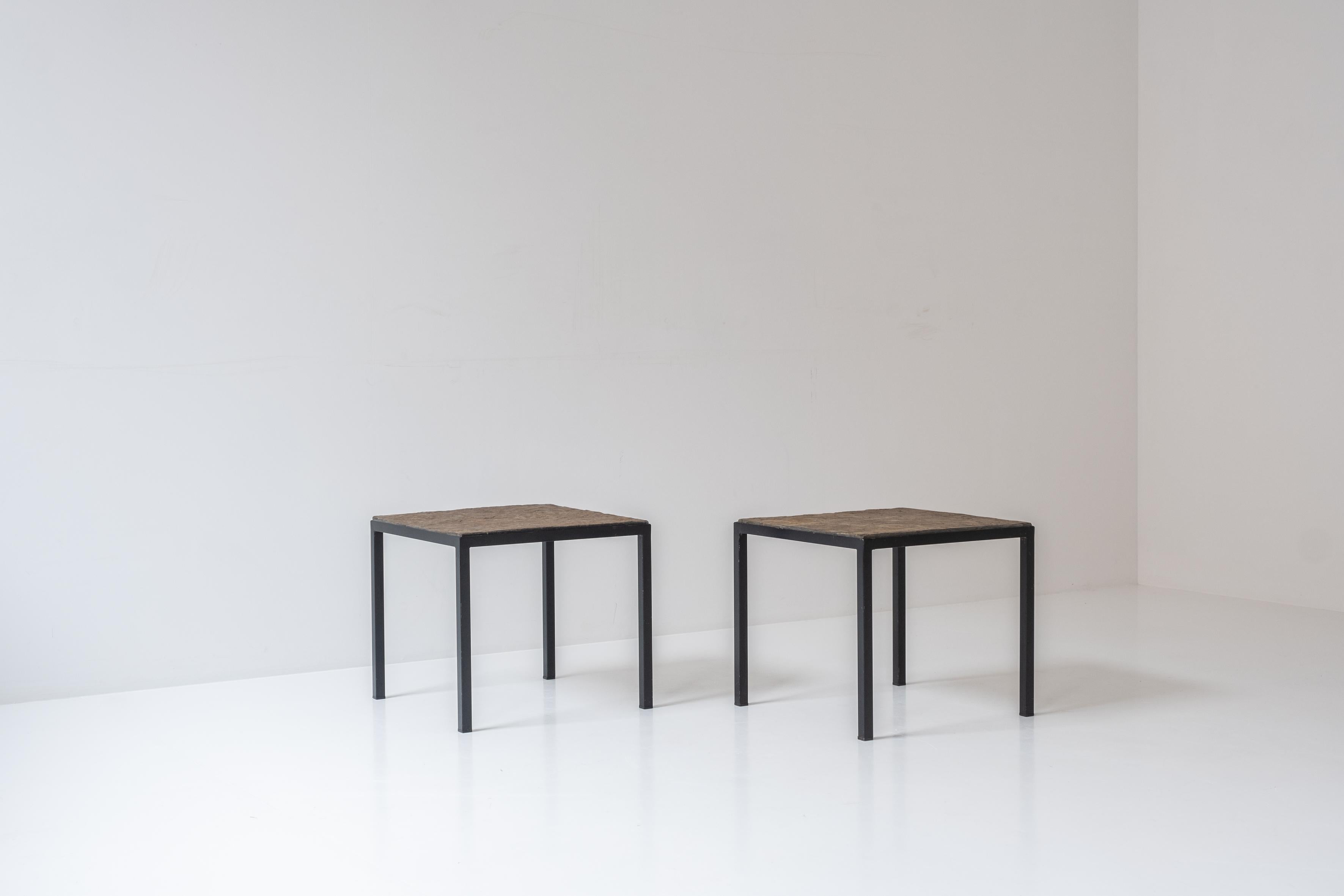 Set of 2 identical square slate stone coffee table from the 1950’s. These elegant coffee tables features black steel frames and slate stone tops. Both presented in its original condition with nice variations on the slate stone giving its a very