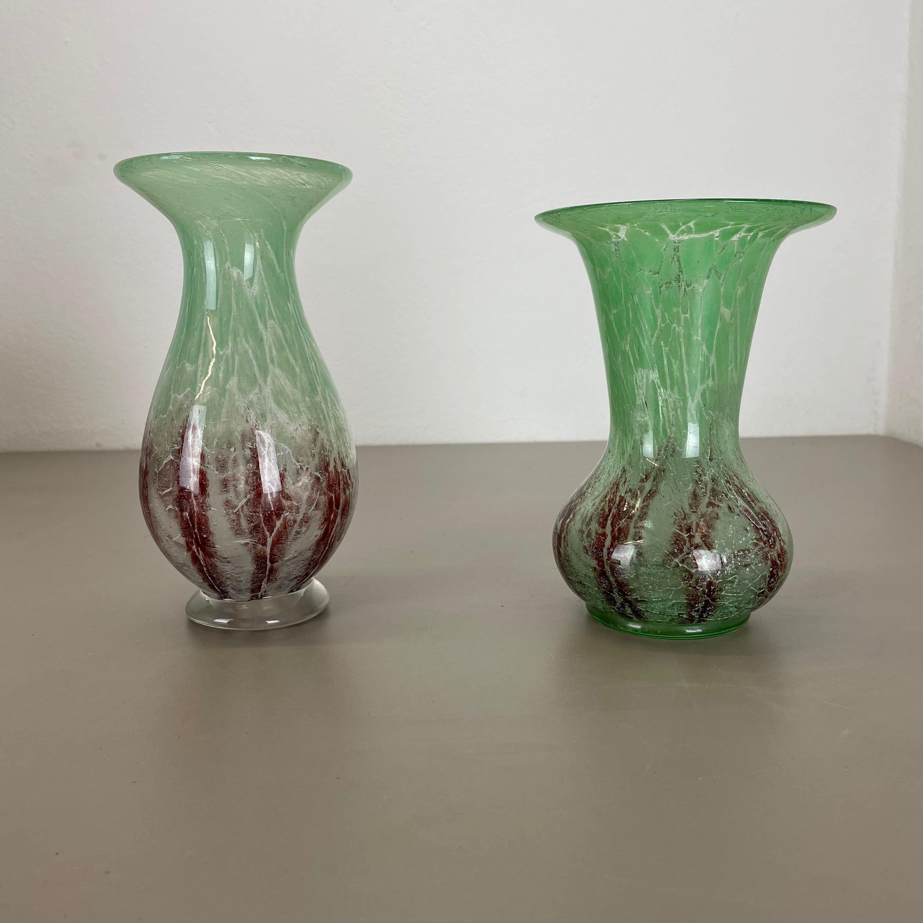 Article: Glass vase, set of 2



Producer: WMF, Germany 



Designer: Karl Wiedmann 


Age: 1930s



Description: 

set of 2 Wonderful heavy Art Deco glass element designed by Karl Wiedmann and produced WMF, Germany in the 1930s.