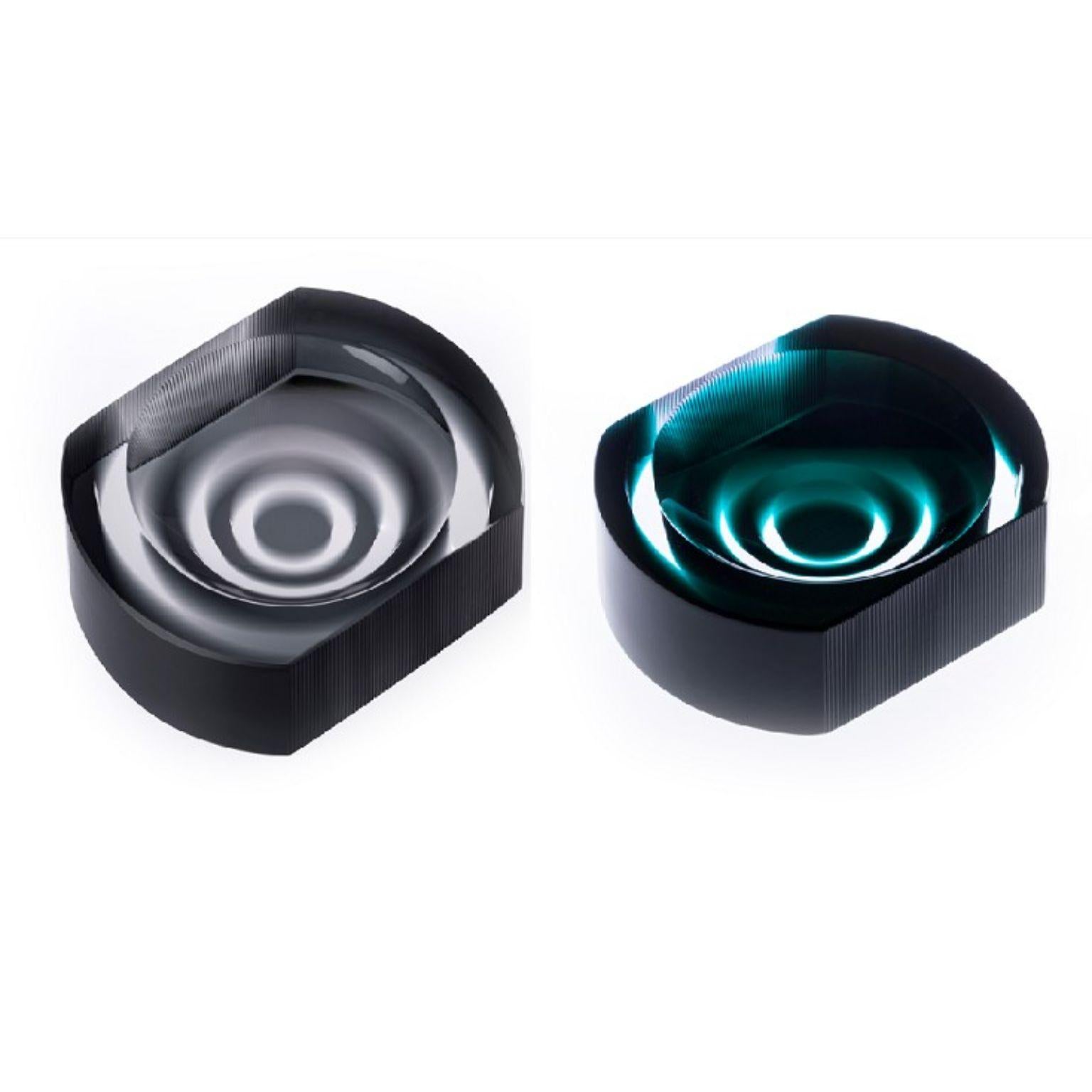 Set of 2 Incisioni Iridi Cut Ashtrays by Purho
Dimensions: D14x H3.5 cm
Materials: Glass
Other colours and dimensions are available.

Purho is a new protagonist of made in Italy design , a work of synthesis, a research that has lasted for