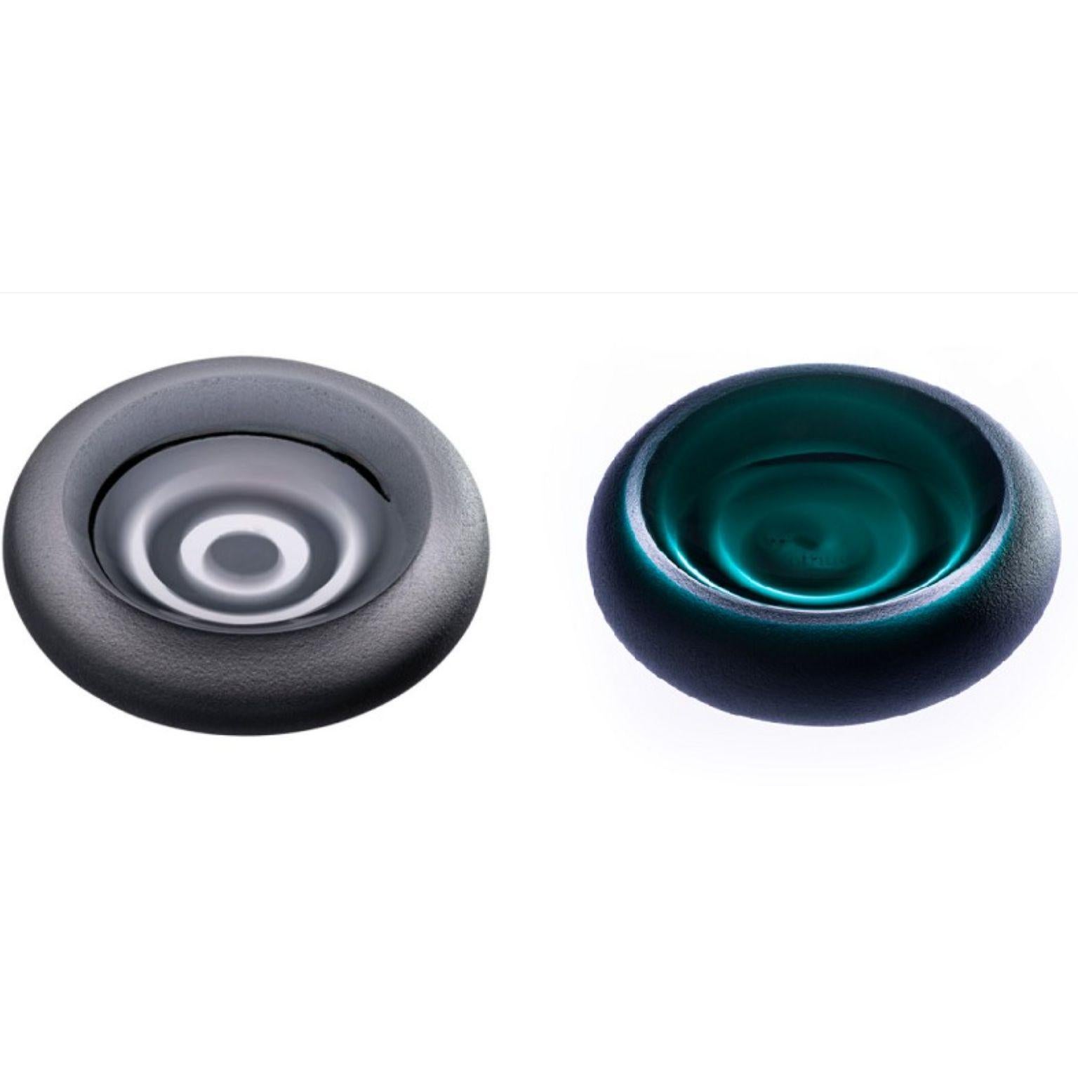 Set of 2 Incisioni Iridi Sand Ashtrays by Purho
Dimensions: D14x H3.5 cm each
Materials: Glass
Other colours and dimensions are available.

Purho is a new protagonist of made in Italy design , a work of synthesis, a research that has lasted for