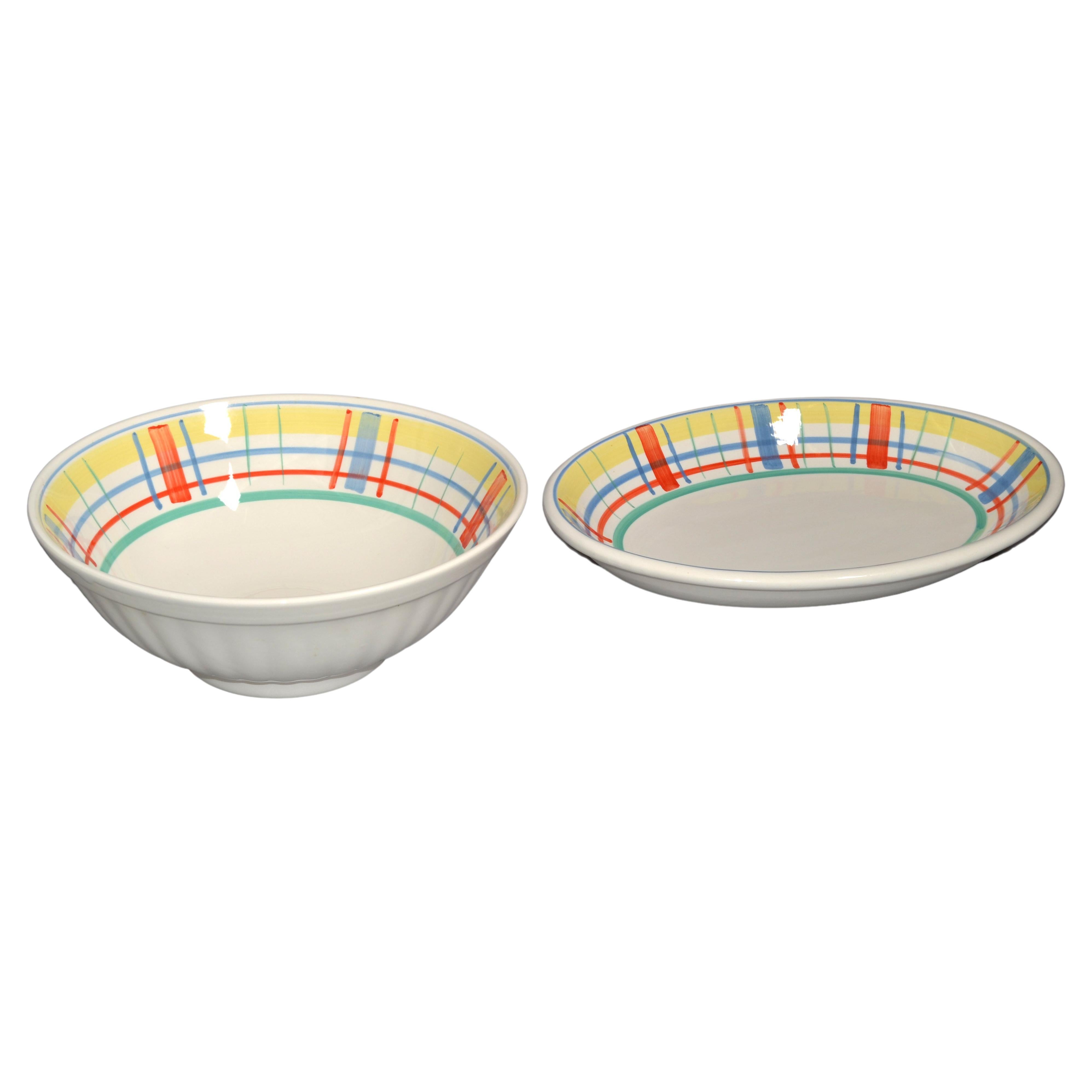 Charming Set of 2 Serveware from Italy made in Ceramic and hand-painted in bright yellow, red, blue and green colors.
The Set consisting out of a round 12.38 inches diameter Serving Bowl and a matching oval Meat or Vegetable Platter.
Both are