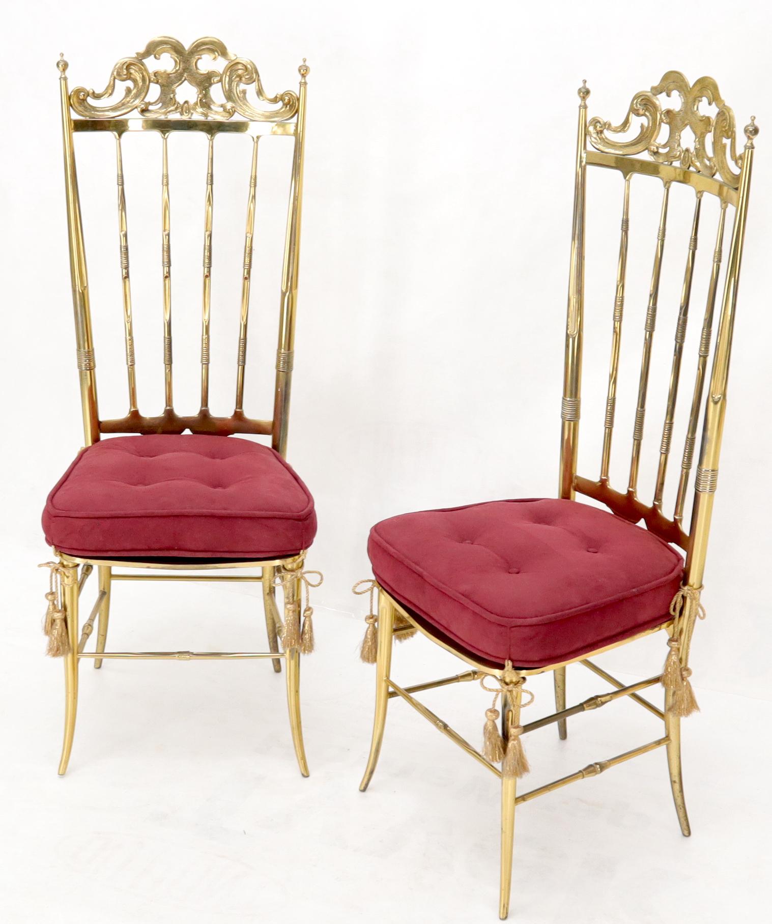 Set of two solid brass Italian Chiavari dining chairs with tall backs.