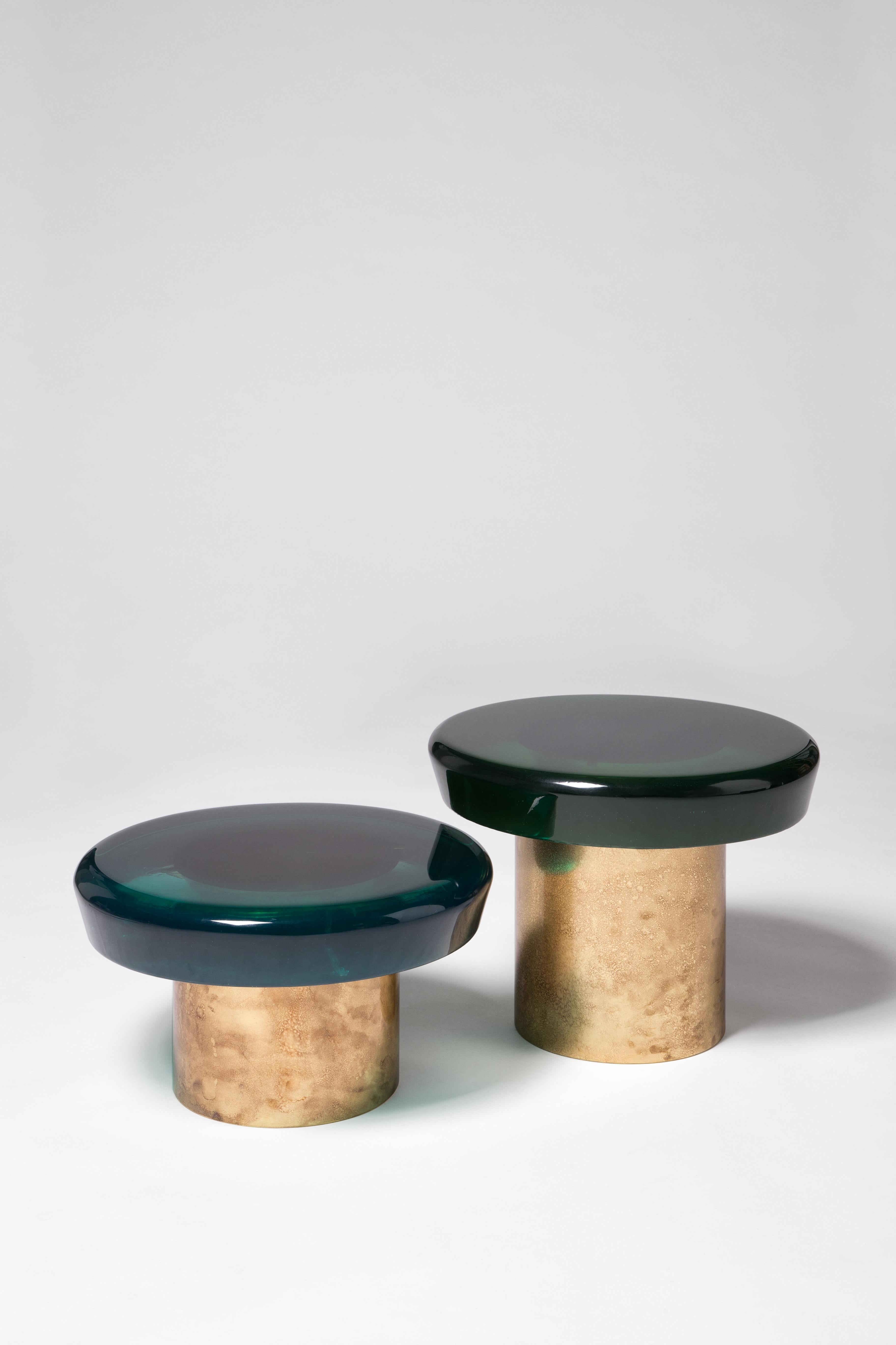 Set of 2 jade coffee table by Draga & Aurel
Dimensions: W 50, D 50, H 28, top Ø 50 cm
W 50, D 50, H 38, top Ø 50 cm
Materials: Resin and bronze

Formed from a combination of reflective resin and solid brass, the Jade coffee tables look like