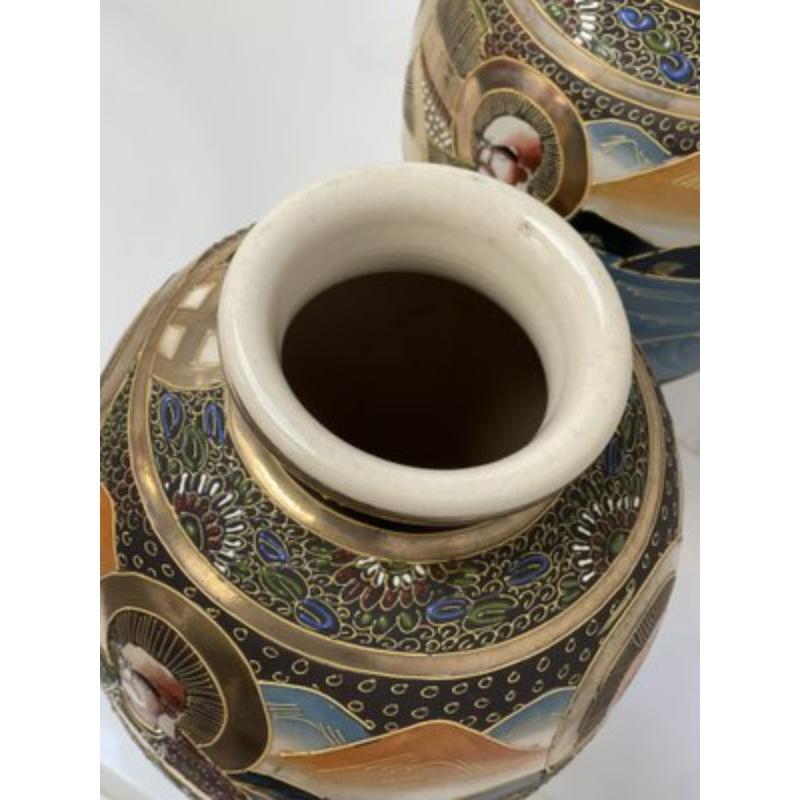 Set of 2 Japanese Satsuma Vases in Polychrome Painted Ceramic, 1920s

Vintage Design
Beautiful pair of Satsuma / Japan vases from the beginning of the 20th century around 1920. Hand -painted ceramic objects with decorations raised by a beautiful
