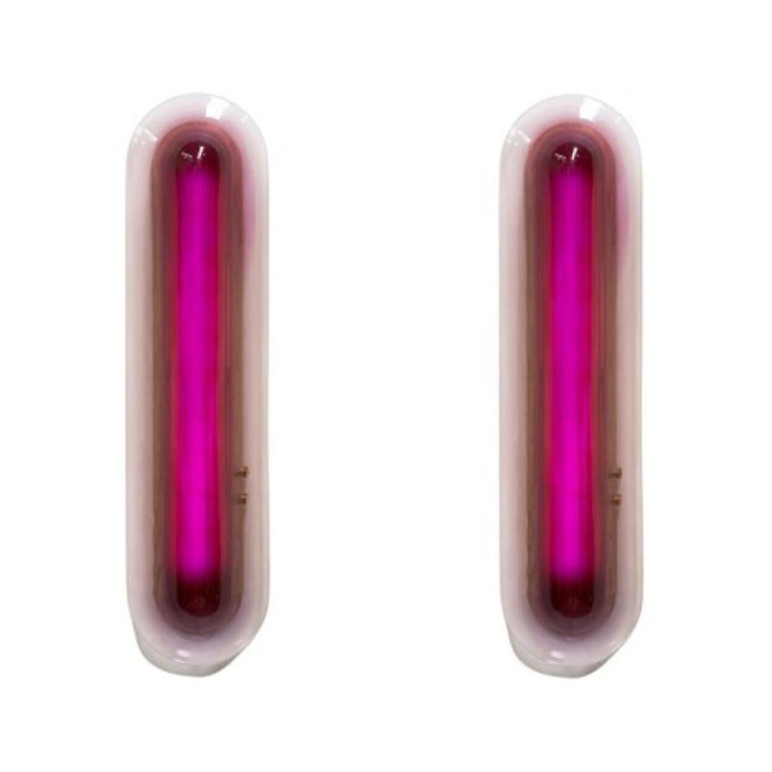 Set of 2 joy wall lamps by Draga & Aurel
Dimensions: W 20, D 13, H 80
Materials: Resin and solid brass

These organic light ‘pills’ reflect the inspiration from the 1970s and the Space Age. The final colour is the result of matching layers of