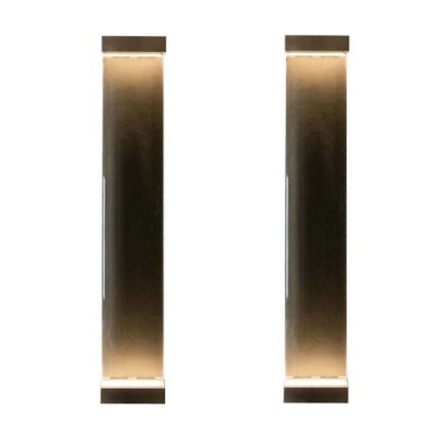 Set of 2 Jud Wall Lamps by Draga & Aurel
Dimensions: W 23, D 10, H 131.
Materials: Resin and brass

All our lamps can be wired according to each country. If sold to the USA it will be wired for the USA for instance.

Inspired by minimalism,