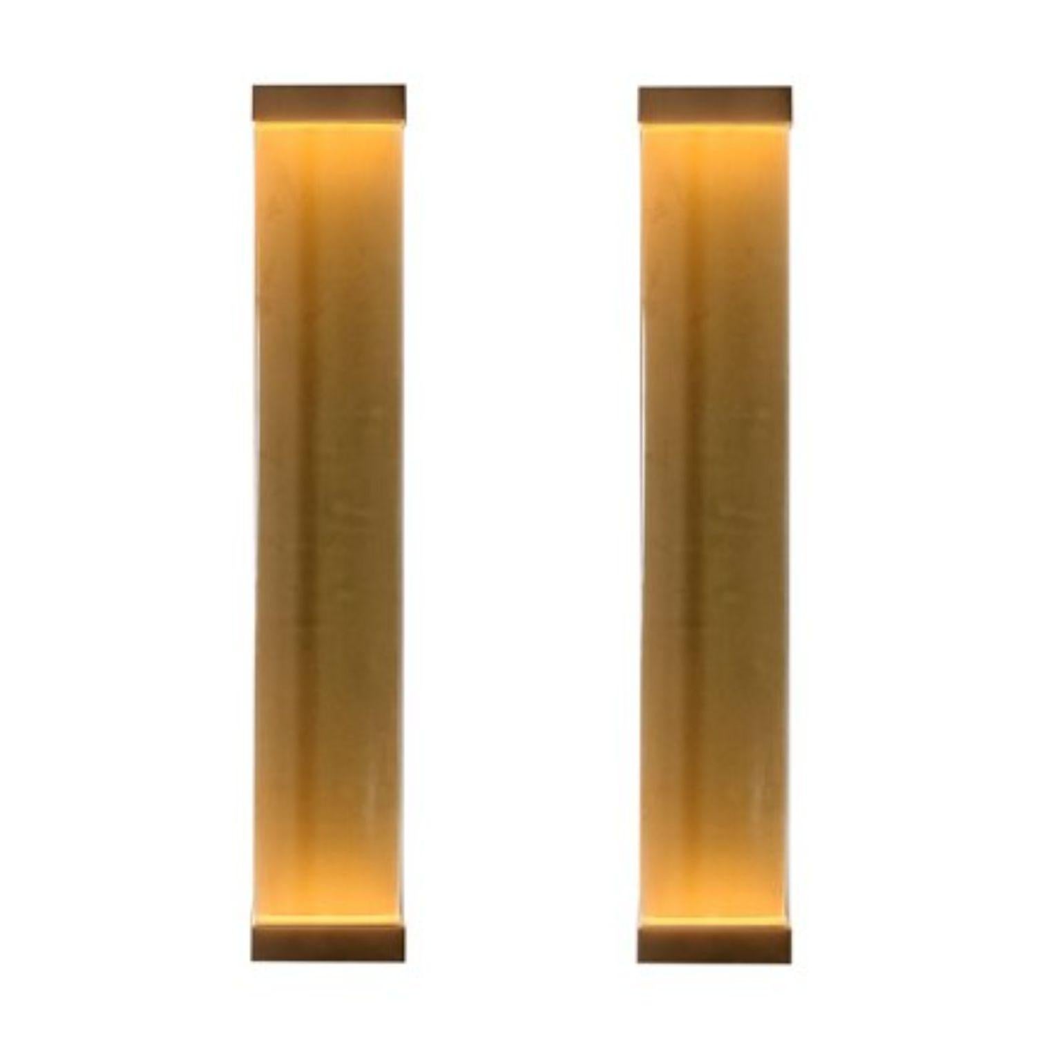 Set of 2 Jud wall lamps by Draga & Aurel
Dimensions: W 23, D 10, H 131.
Materials: Resin and brass

All our lamps can be wired according to each country. If sold to the USA it will be wired for the USA for instance.

Inspired by minimalism,