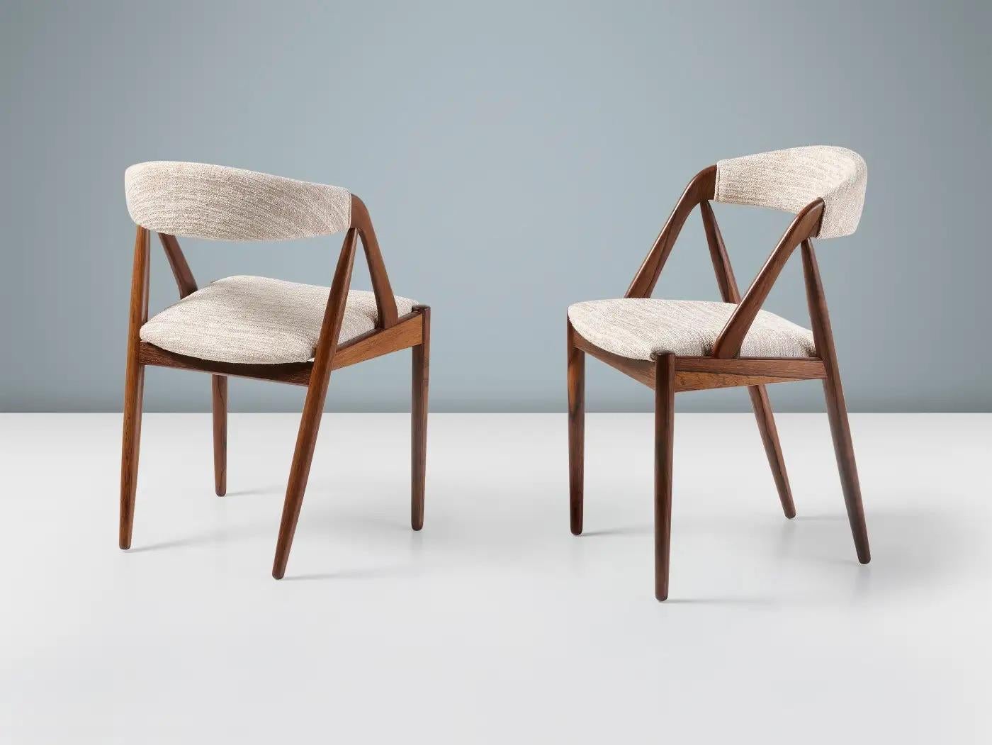 Kai Kristiansen - Model 31 Dining Chairs

A set of 2 dining chairs produced by Skovman Andersen Mobelfabrik in the early 1960s and designed by master of Danish mid-century design: Kai Kristiansen. The gorgeous rosewood frames have been refinished in