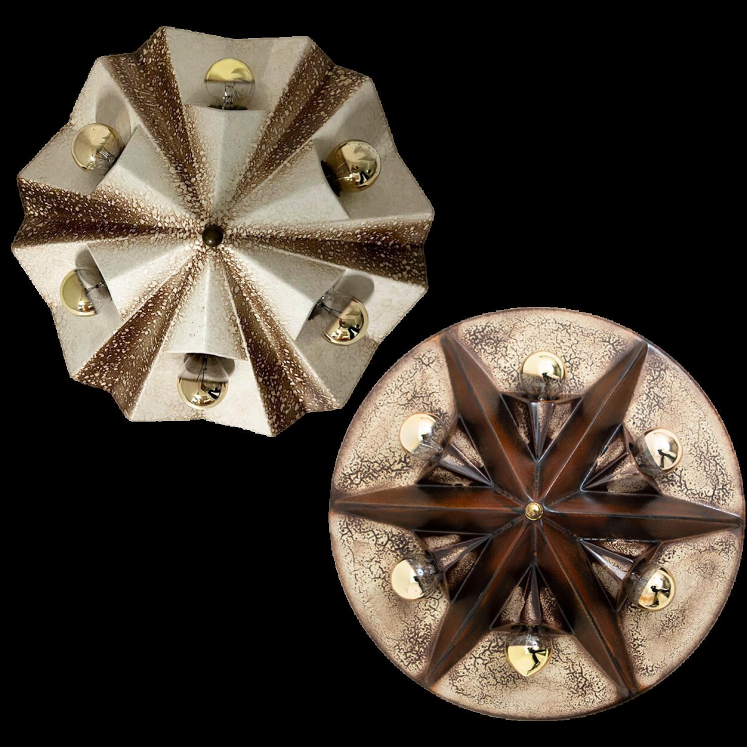 Beautiful and graphical star-shaped wall or ceiling lamps, made with brown and beige ceramic, manufactured in the 1970s in Germany.

We used gold mirror light bulbs (see images), but silver mirror, soft gold or white light bulbs are also very