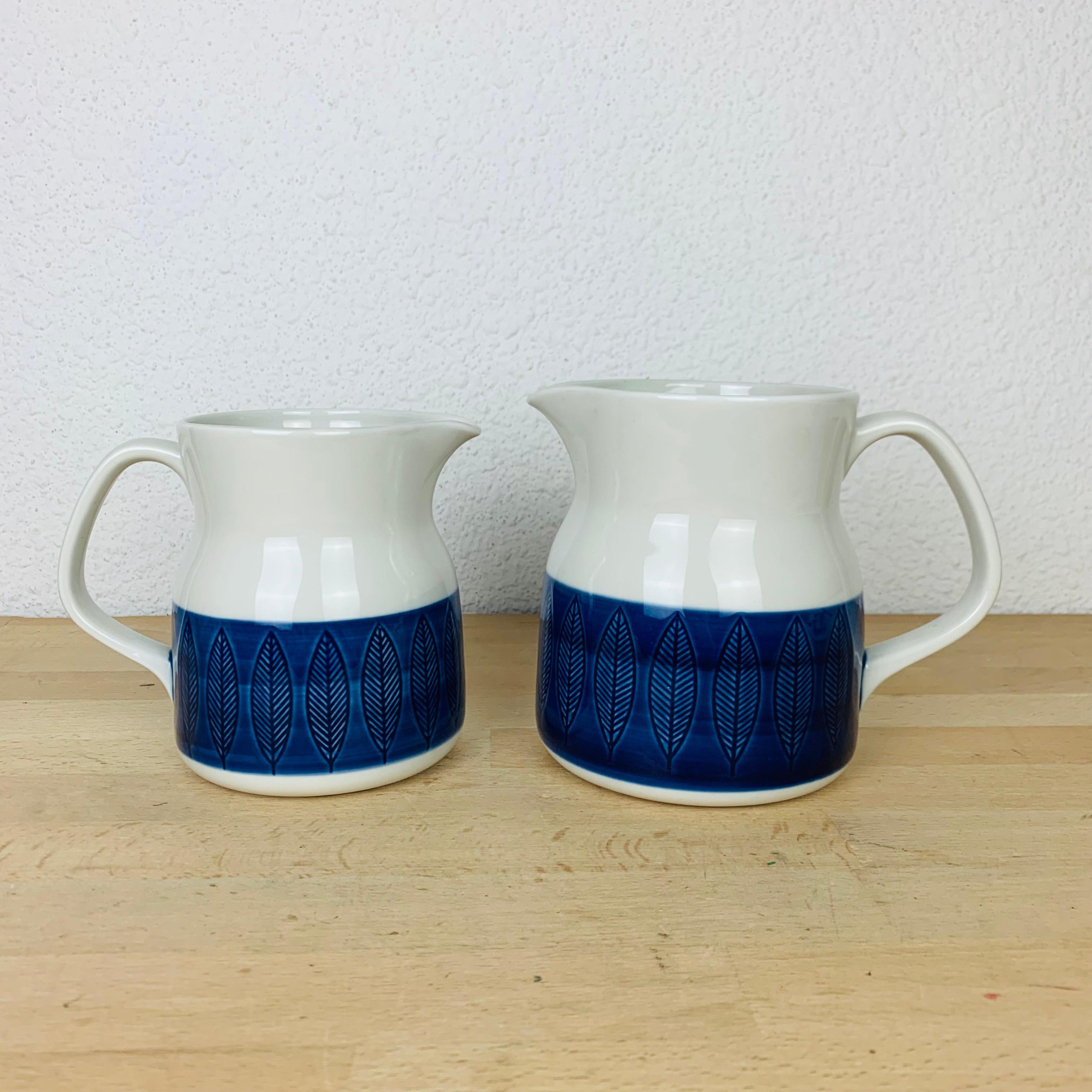 Koka pitchers by Hertha Bengtson for Rörstrand Sweden, manufactured in the 1960's. 

Slight wear due to their age and use, no chip, no crack. 

Measurements : height 14 cm / 13 cm, top diameter 10, 5 cm / 9 cm, bottom diameter 12 cm / 10, 5 cm,