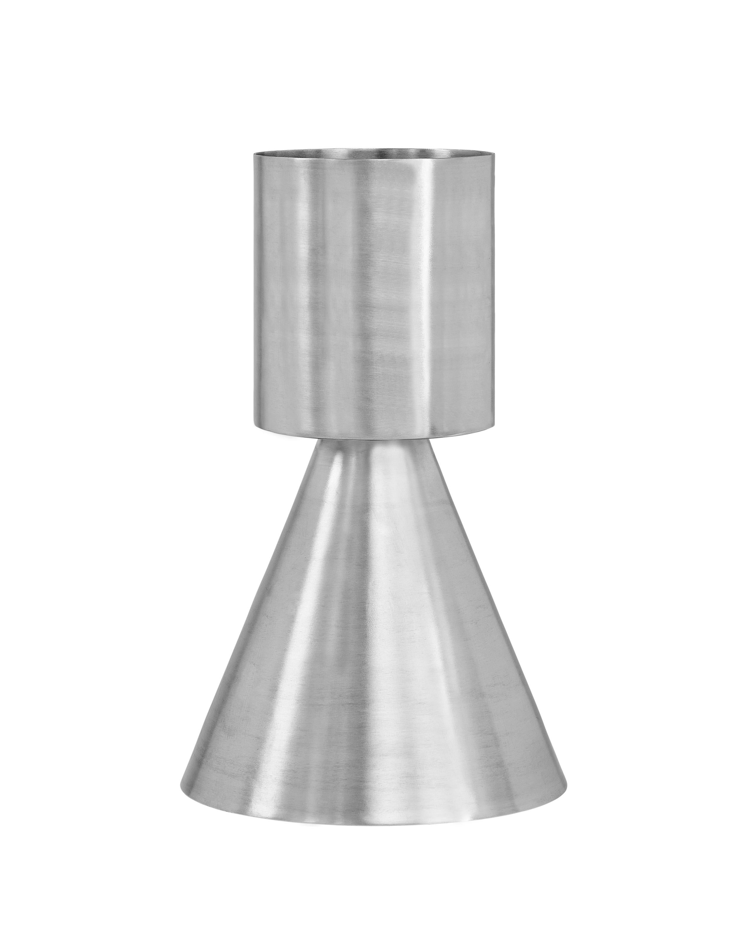 Set of 2 large Ada planters by Llot Llov
Dimensions: Ø 32 cm x H: 52 cm
Pot 1: Ø 19 cm x 22 cm; Pot 2: Ø 32 cm x 30 cm
Materials: brushed raw aluminium
Also available in black powder-coated. 

Ada Planter was made in a metal spinning process out of