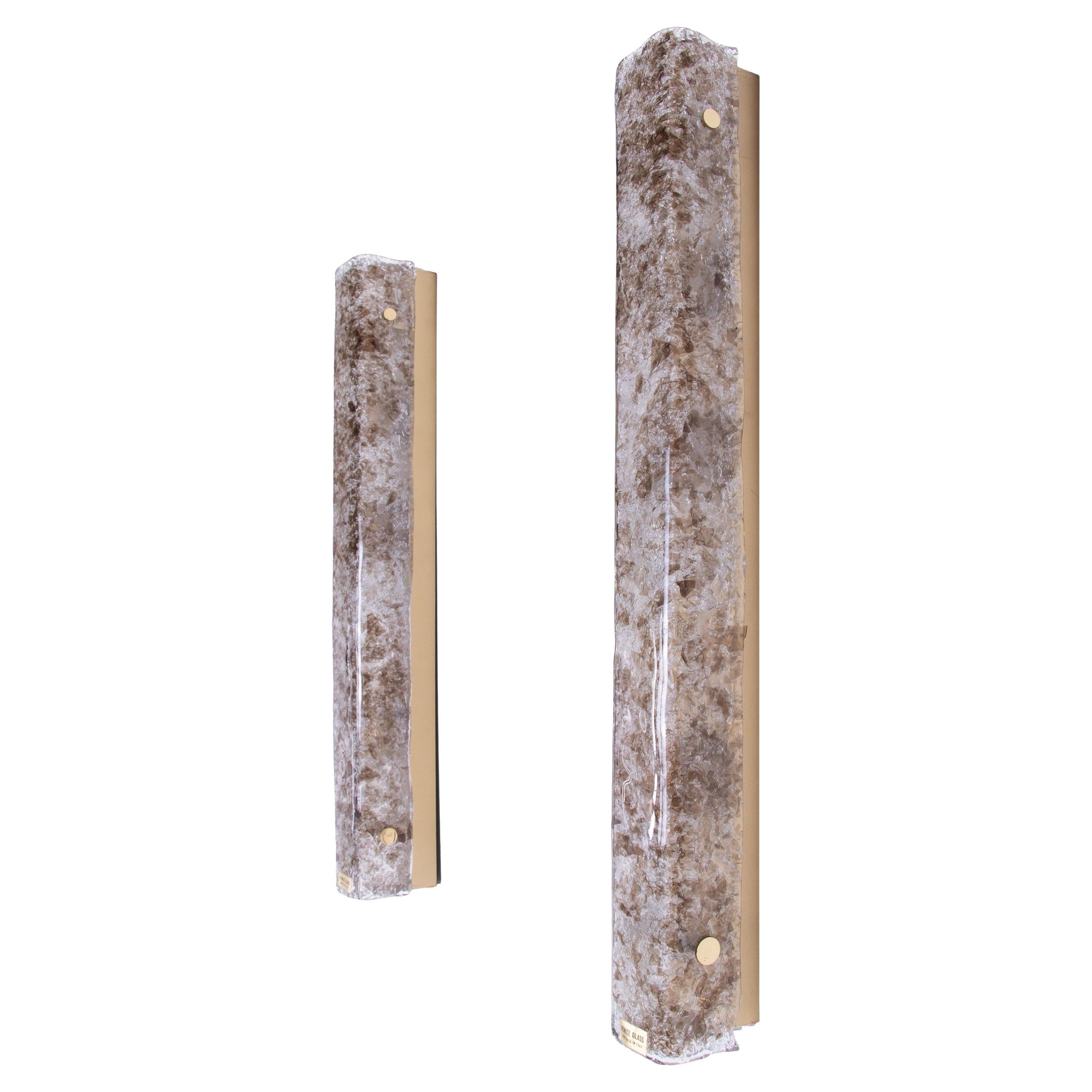 Large set of two mirror wall sconces made of heavy, thick hand blown textured amber/brown and clear Venice Murano glasses on a brass frame. Gem from the time. With these lights, you can make a clear statement in your interior design. A real
