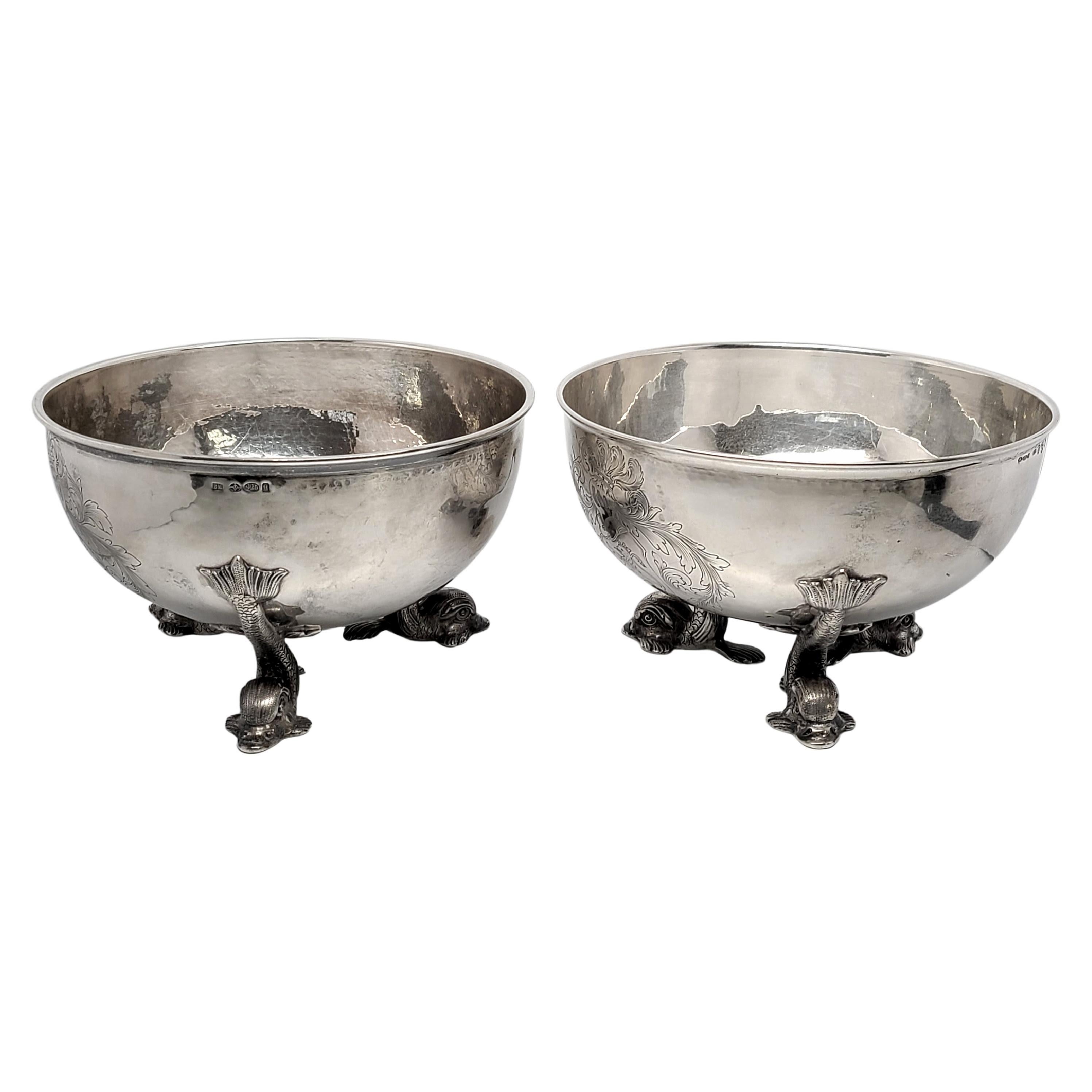 Set of 2 antique Hanau sterling silver large footed bowls.

Large and substantial bowls are lightly hammered with an etched knight design. Each sits atop has 3 fish shaped feet.

Each bowl has slightly different hallmarks, but the hallmarks