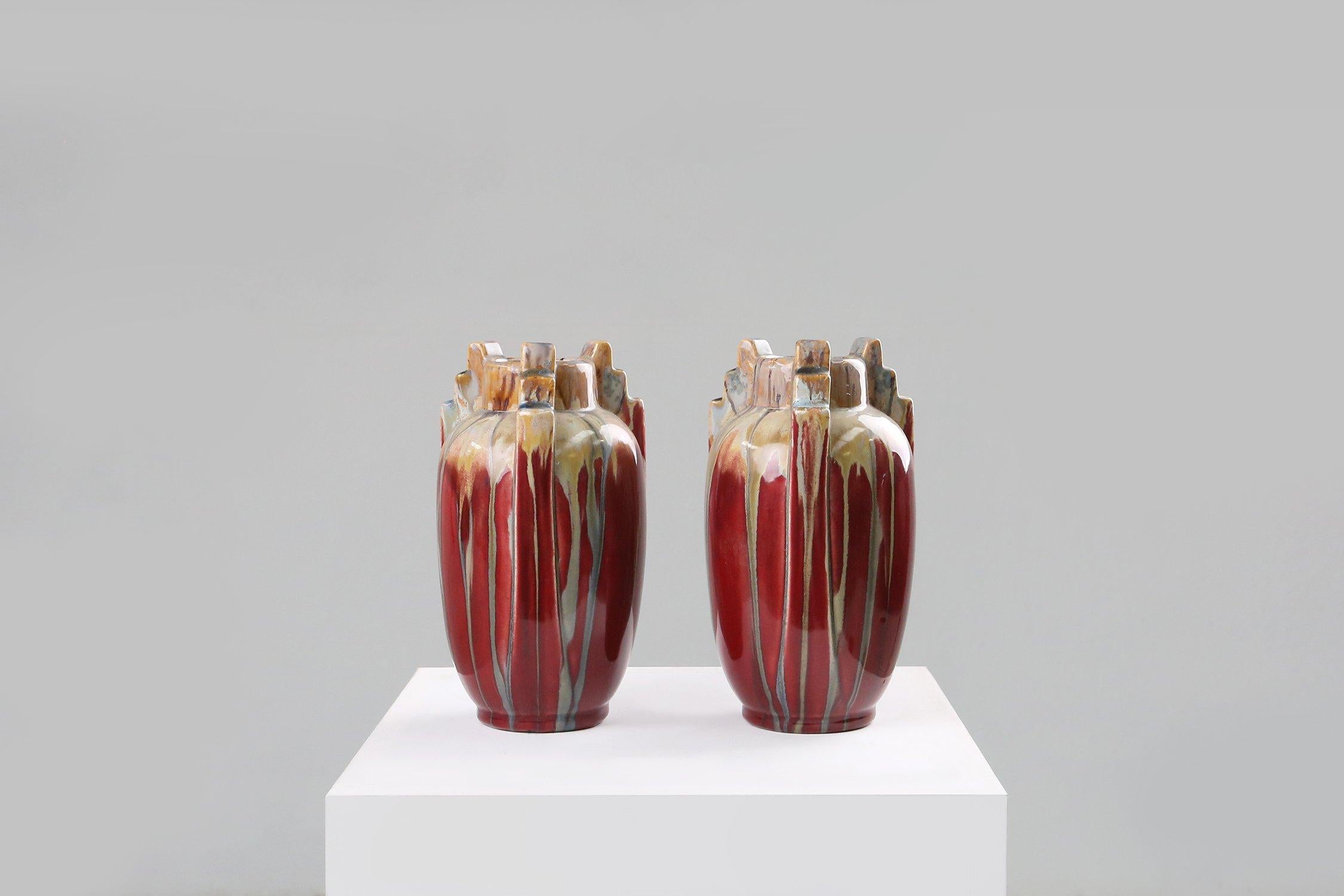 Set of Art Deco vases made in ceramic with great colors of red, brown, yellow.
Has the beautiful geometric details that really represents the Art Deco period of the 1930.