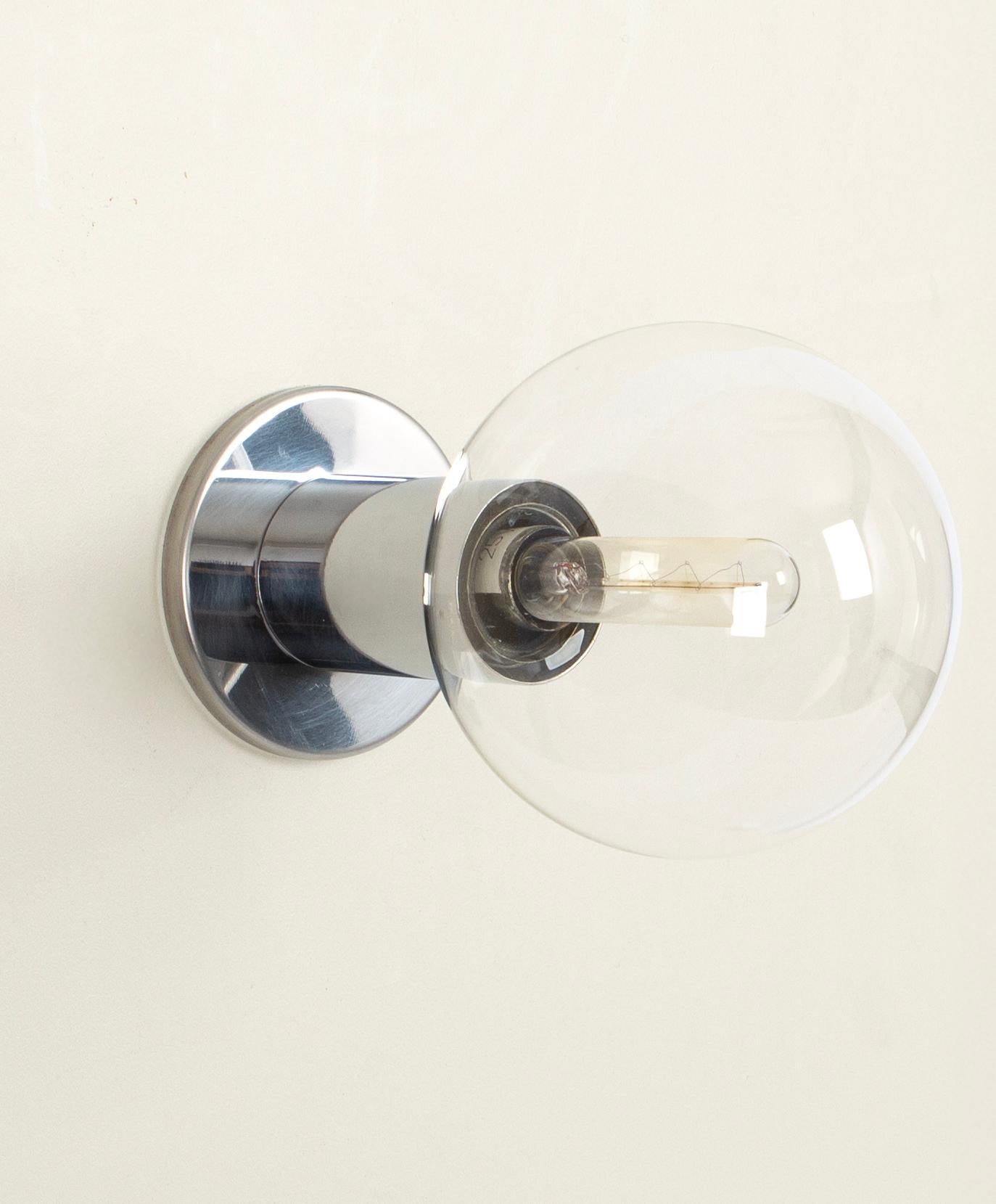 Set of 2 large chrome wall lights Motoko Ishii, Staff, Germany 1970s
High quality made in Germany made of glass and chrome metal.
Design Motoko Ishii

Each wall light needs 1 x E14 small bulb.
Light bulbs are not included. It is possible to install