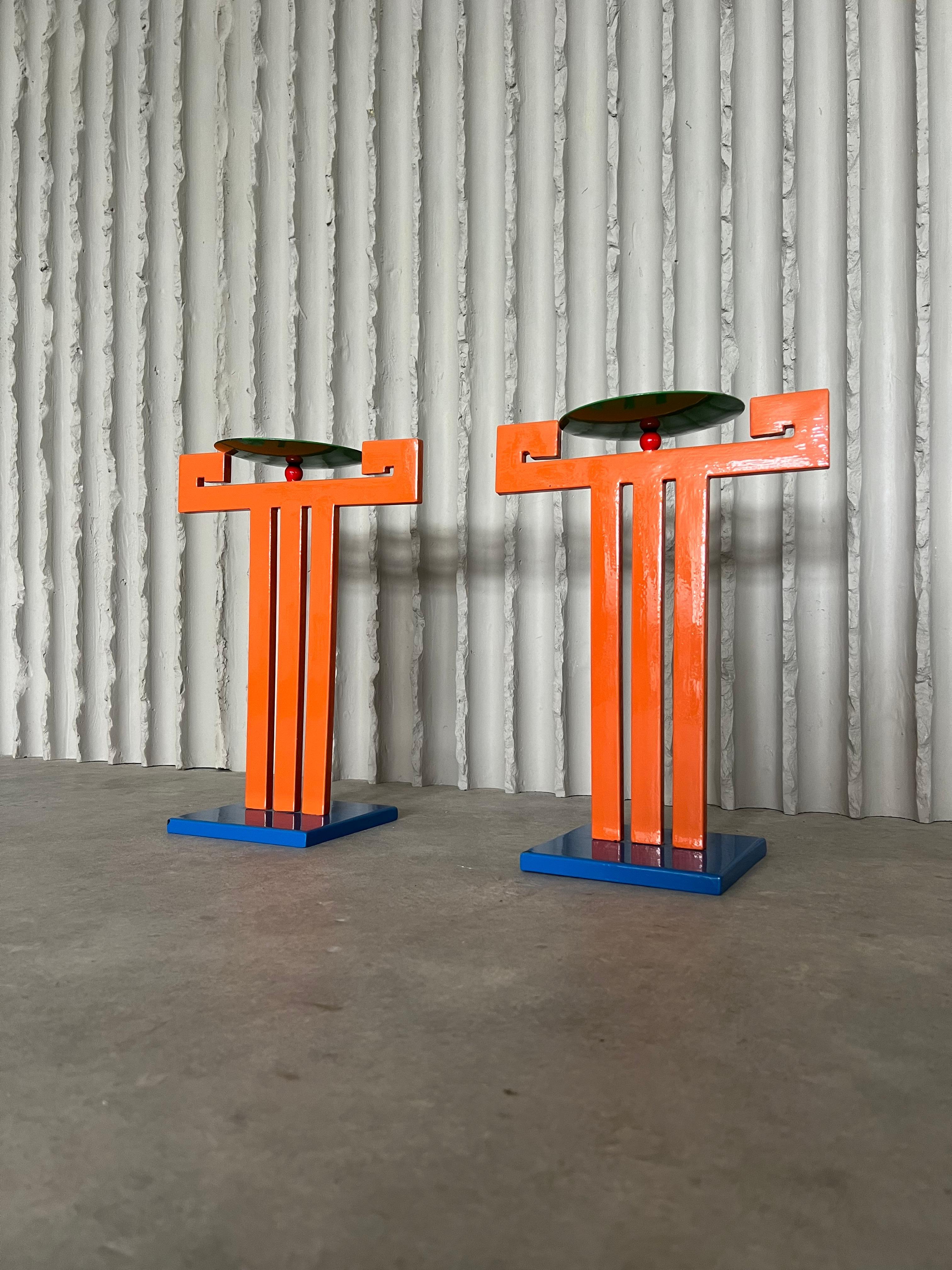 Set of 2 large steel Memphis candle holders. The graphic design, the colors and the fun appearance, all very typical for the Memphis style. In good vintage condition with a few small paint damages. 