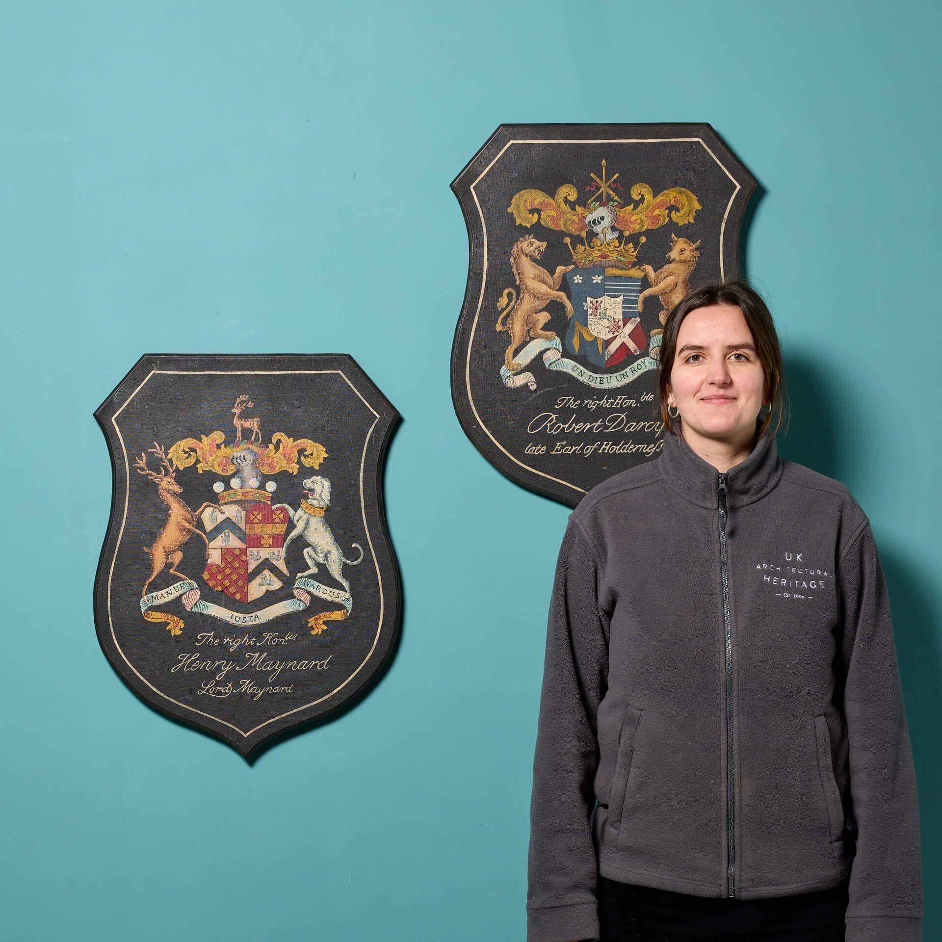 A set of 2 large reclaimed armorial panels. Each shield features titles of historical figures in Latin with a striking family crest to the centre. This pair would make an impressive wall decoration adding heritage and grandeur to any period or