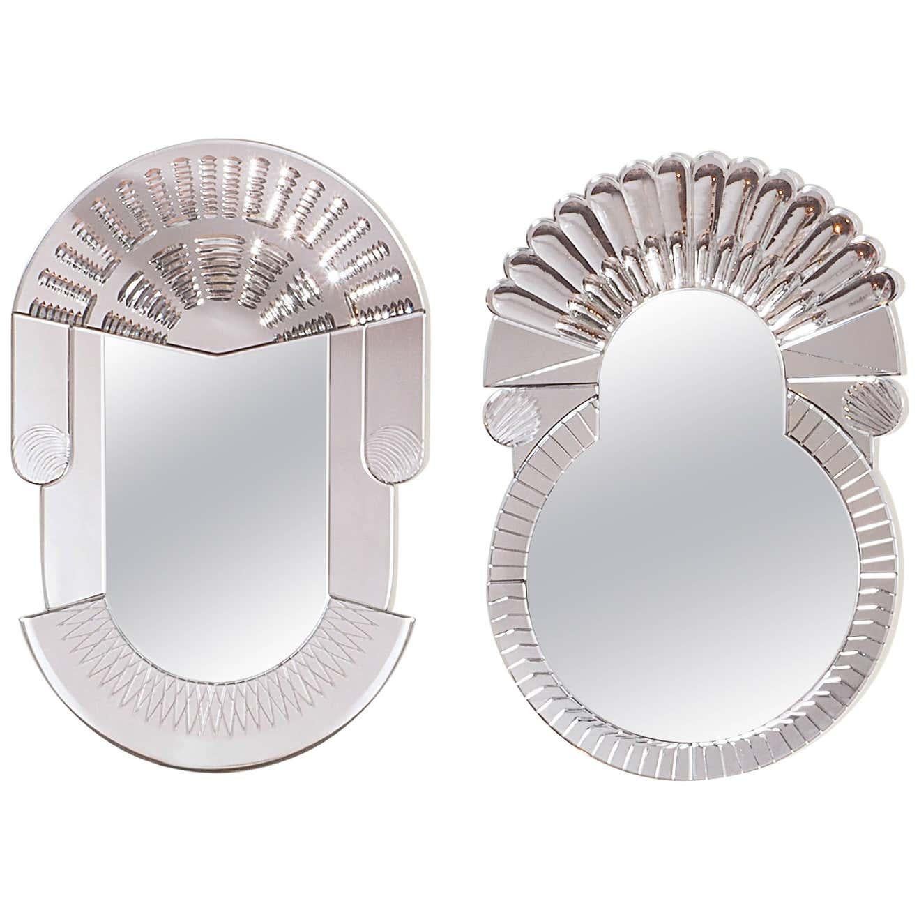 Set of 2 large scena Murano mirrors by Nikolai Kotlarczyk. 
Dimensions: 
Olympic: D 3 x W 60 x H 90 cm 
Rotonda: D 3 x W 60 x H 90 cm 
Materials: silvered carved glass, golden carved polished steel. Nembro marble (base).
Also available in