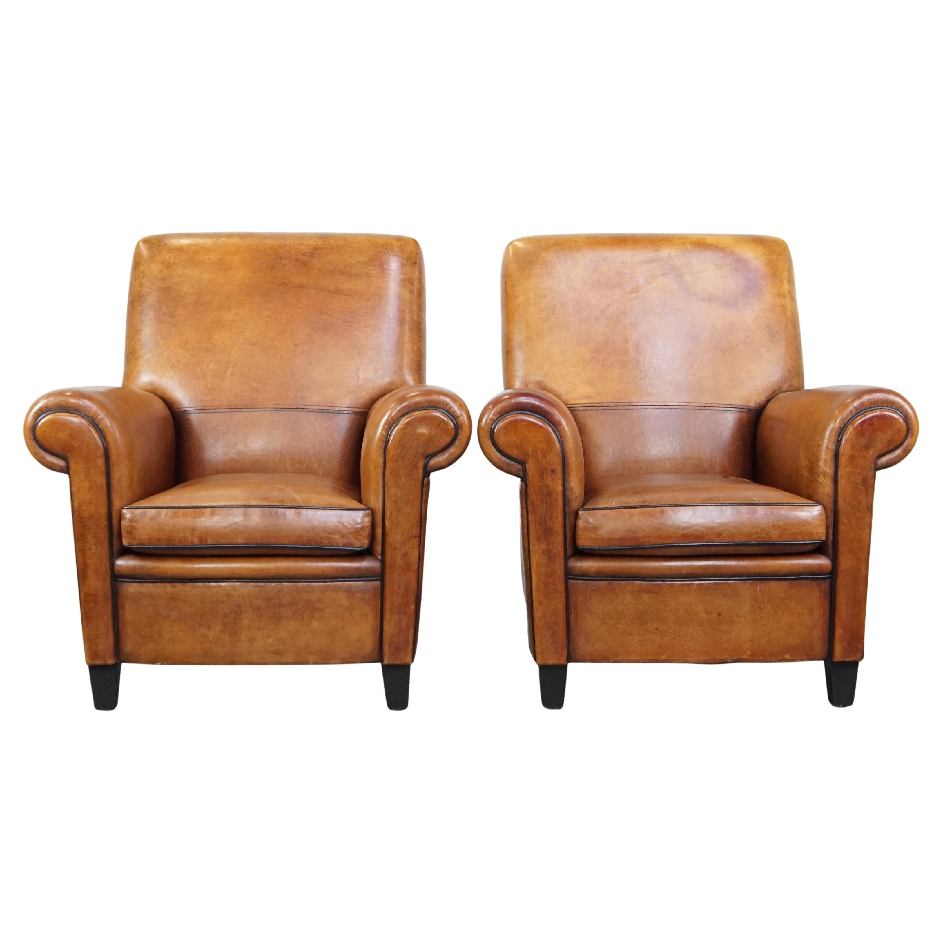 Set of 2 large, sturdy, comfortable vintage cognac-colored sheepskin armchairs