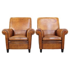 Set of 2 large, sturdy, comfortable vintage cognac-colored sheepskin armchairs