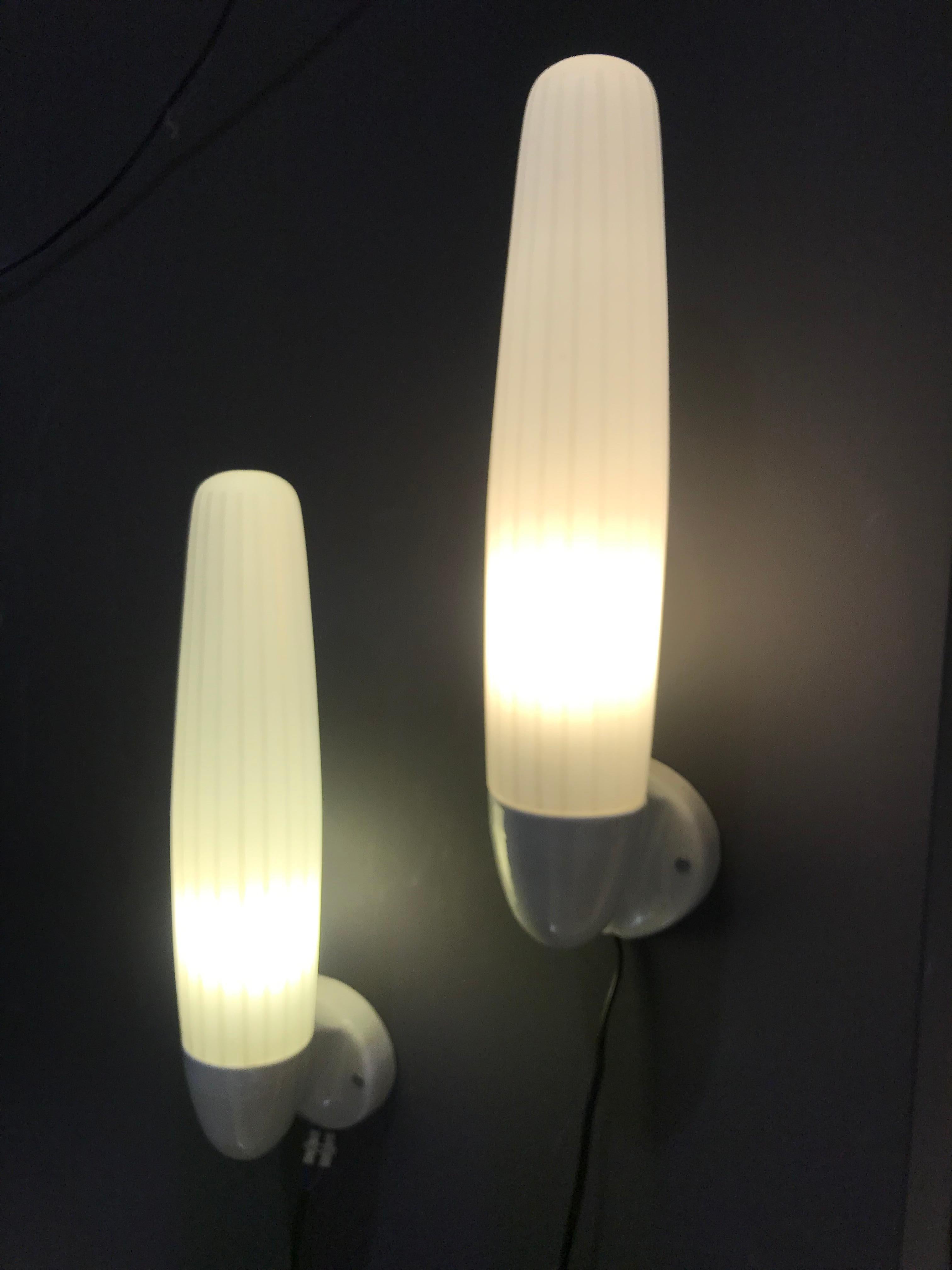 Set of 2 large midcentury wall lamps by Wilhelm Wagenfeld. Manufactured by Lidner in West-Germany late 1950s, begin 1960s. In good working condition.