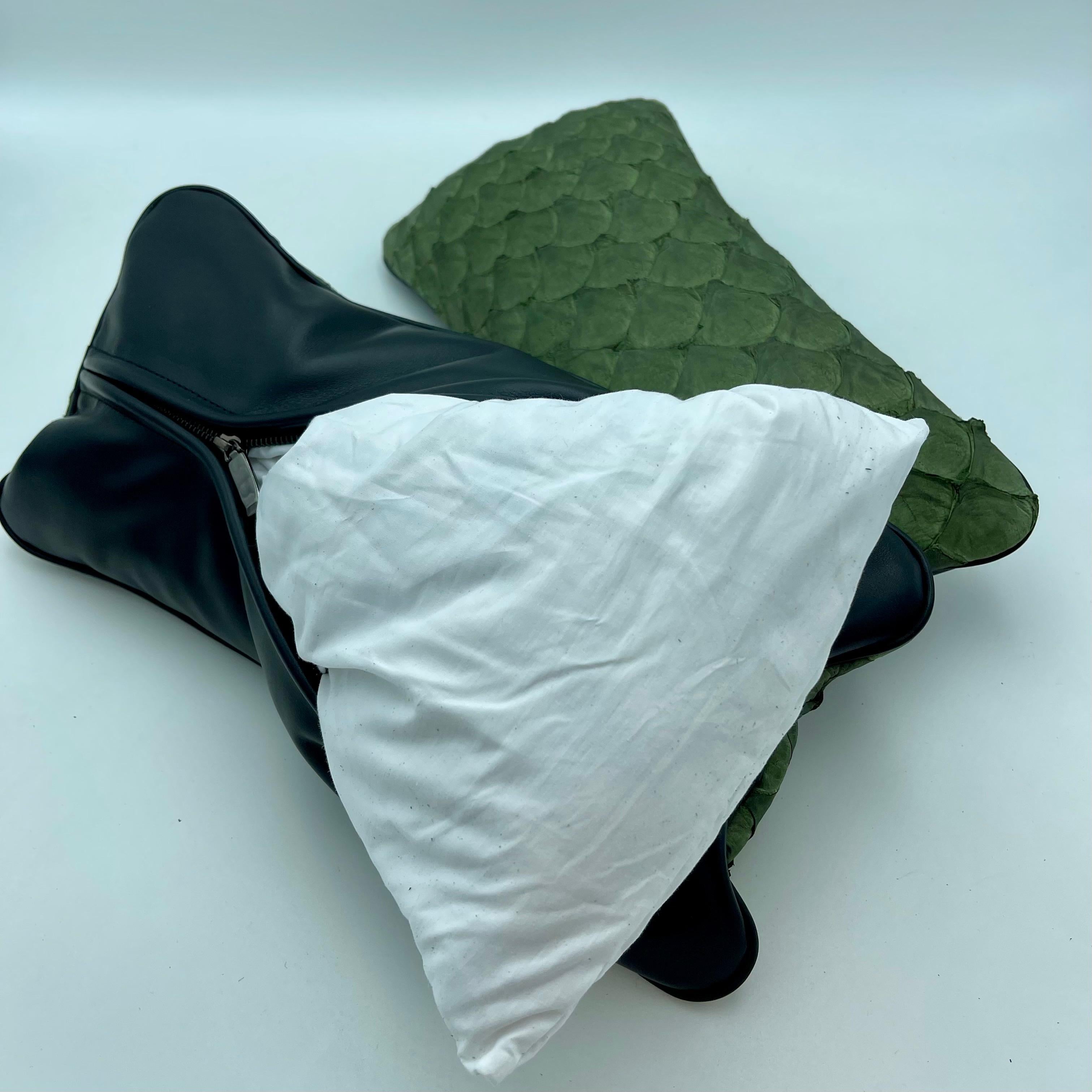 Set of 2 leather cushion, exclusive fish leather black color and black back, small size 15.7 x 7.9 in. Untrimmed scales.

Fish leather luxury cushion. Skins used on these cushions comes from Brazilian food industry, it is the second largest river