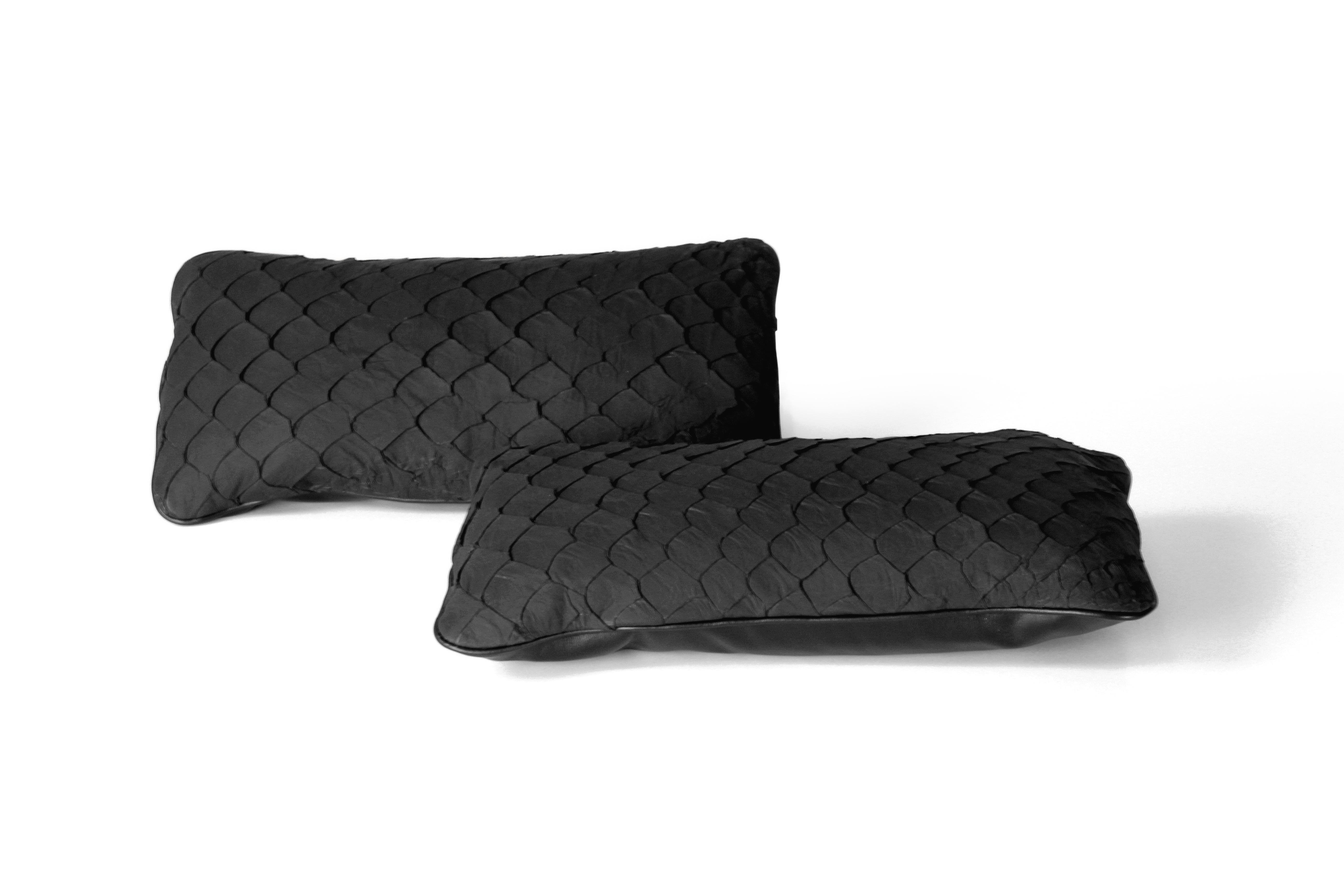 Set of 2 leather cushion, exclusive fish leather black color and black back, small size 15.7 x 7.9 in. Trimmed scales.

Fish leather luxury cushion. Skins used on these cushions comes from Brazilian food industry, it is the second largest river