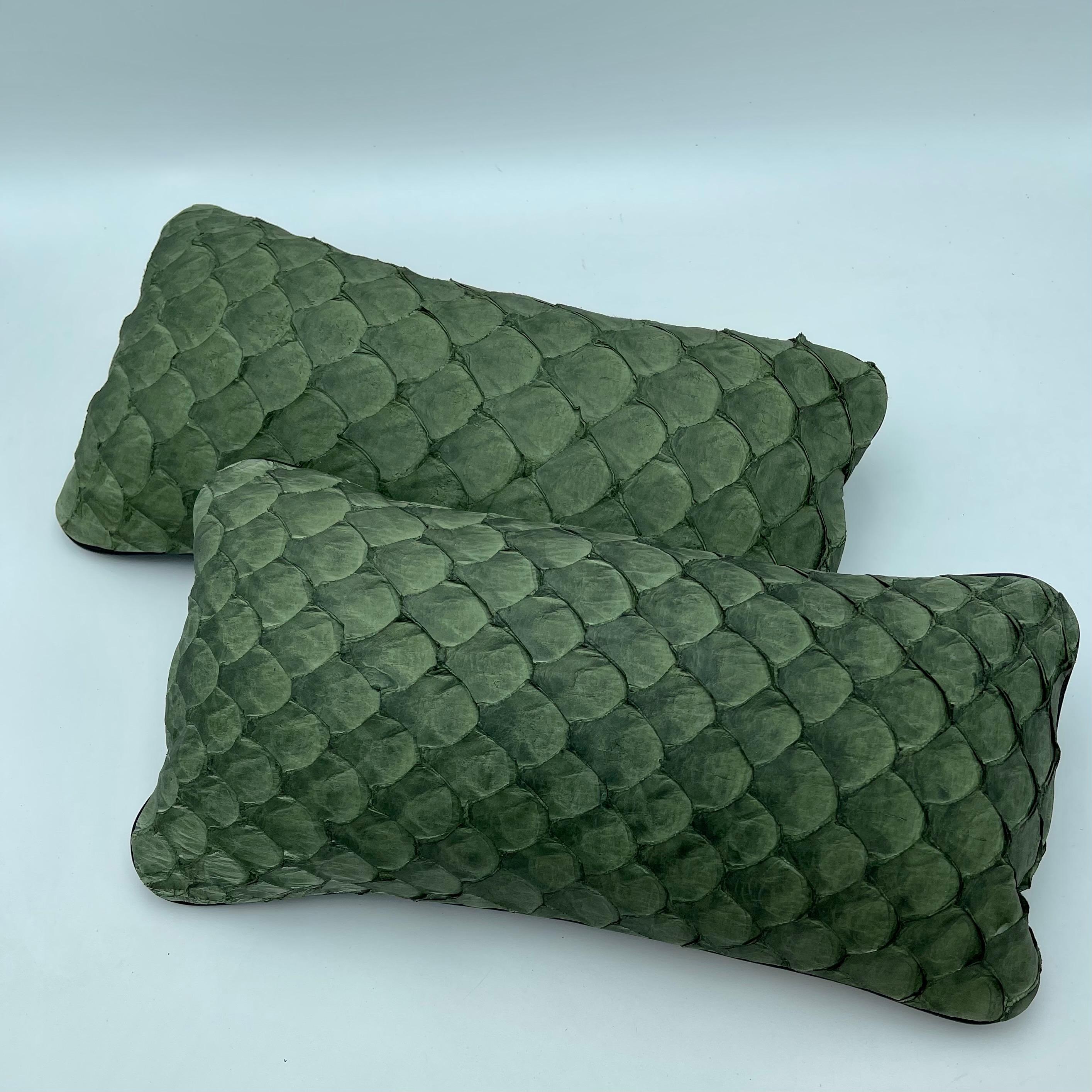 Set of 2 leather cushion, exclusive fish leather green color and black back, small size 15.7 x 7.9 in. Trimmed Scales

Fish leather luxury cushion. The fish skins comes from Brazilian food industry, it is the second largest river fish in the world