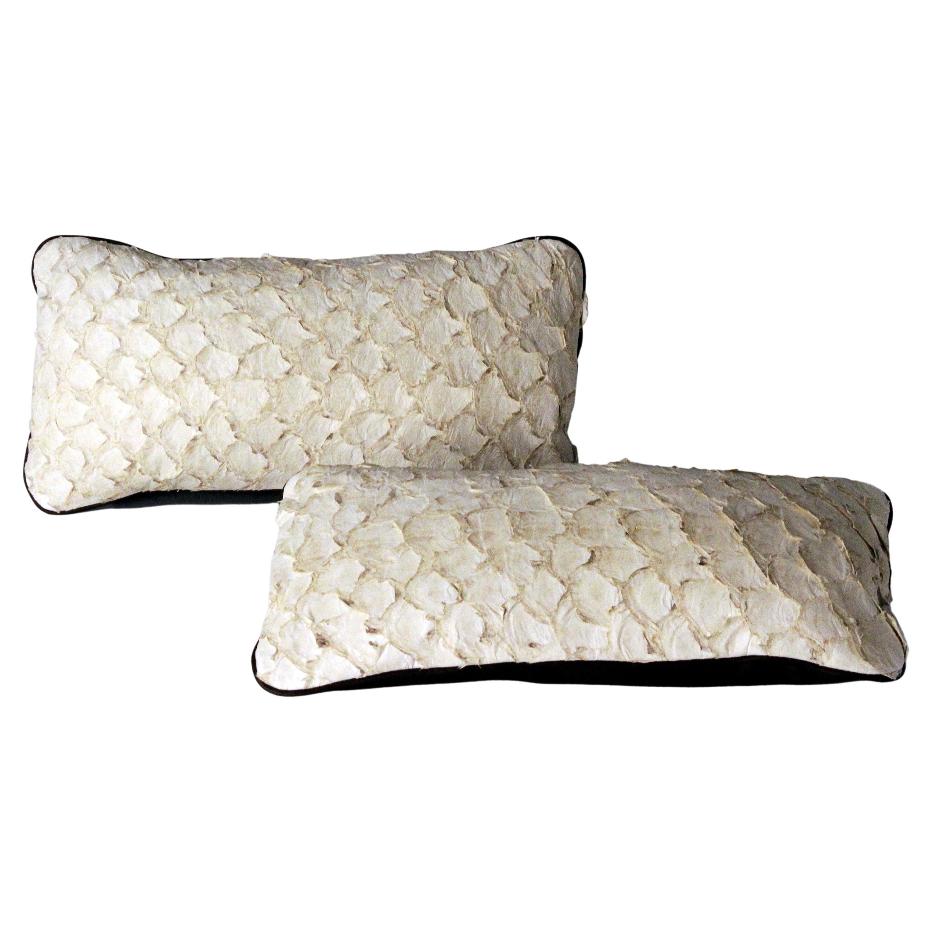Set of 2 leather cushion, exclusive fish leather off-white color and dark brown back, small size 15.7 x 7.9 in. Untrimmed scales

Fish leather luxury cushion. The fish skins comes from Brazilian food industry, it is the second largest river fish in