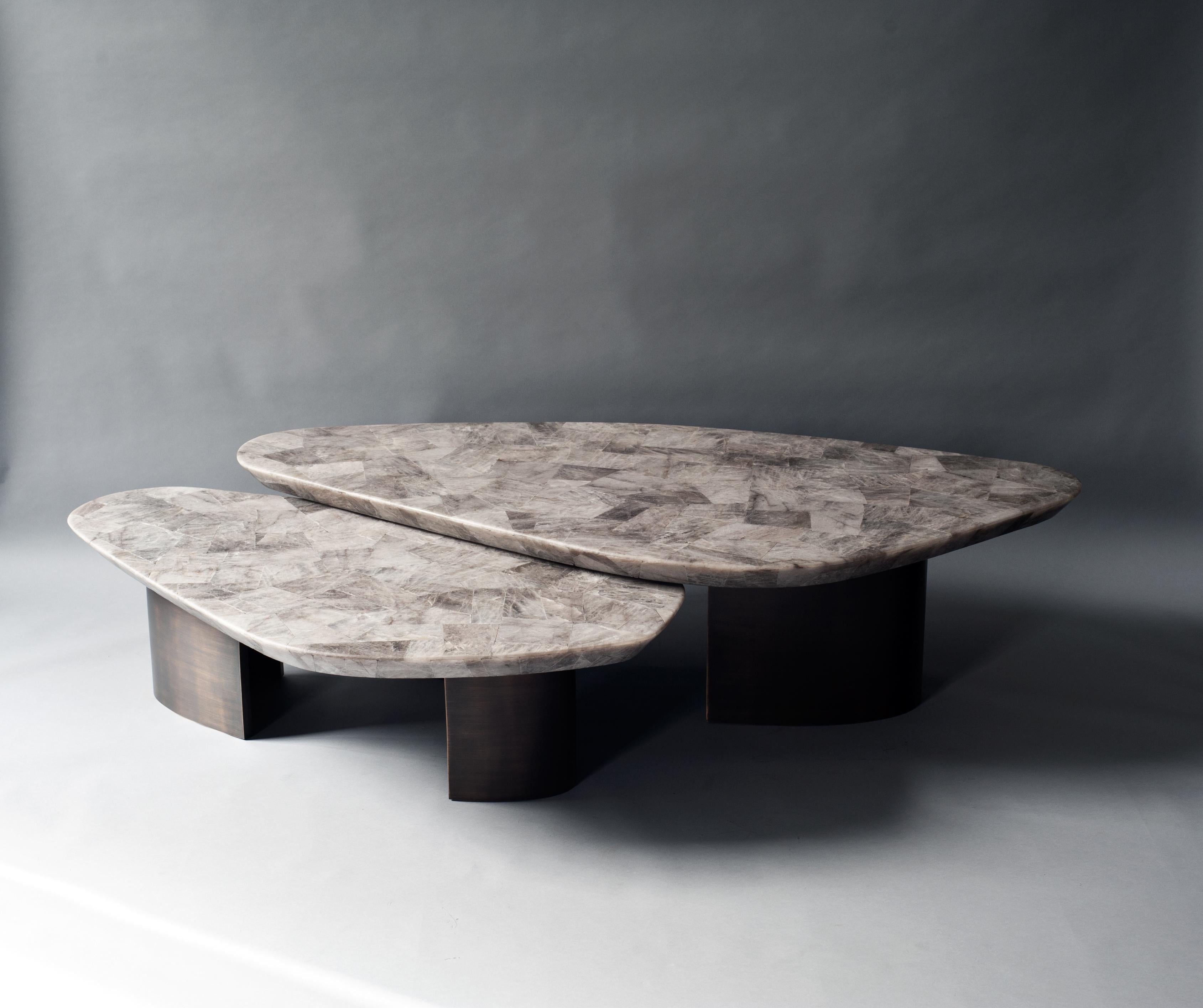 Set of 2 ledge coffee table by DeMuro Das
Dimensions: W 162.2 x D 80.7 x H 39.4 cm
W 126.6 x D 68 x H 32.9 cm
Materials: Quartz (Smokey) - Leather (Random)
 Solid brass (Antique)

Dimensions and finishes can be customized.

DeMuro Das is an
